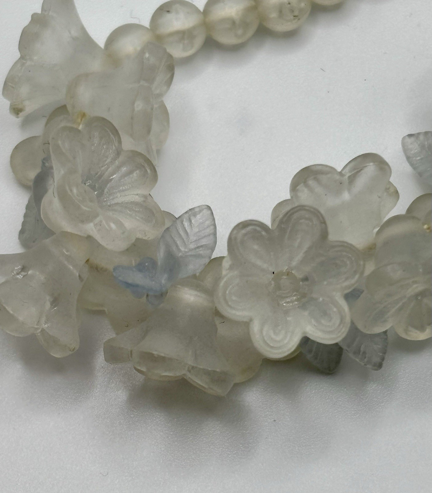 Vintage lucite floral cluster bib necklace molded flowers and leaves. 18”