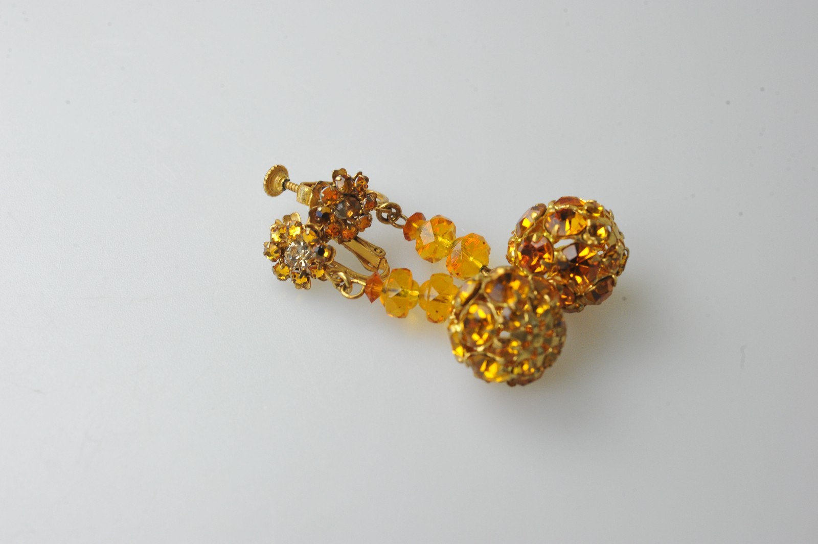 Vtg signed Miriam Haskell rhinestone Gold Tone drop clip earrings amber color