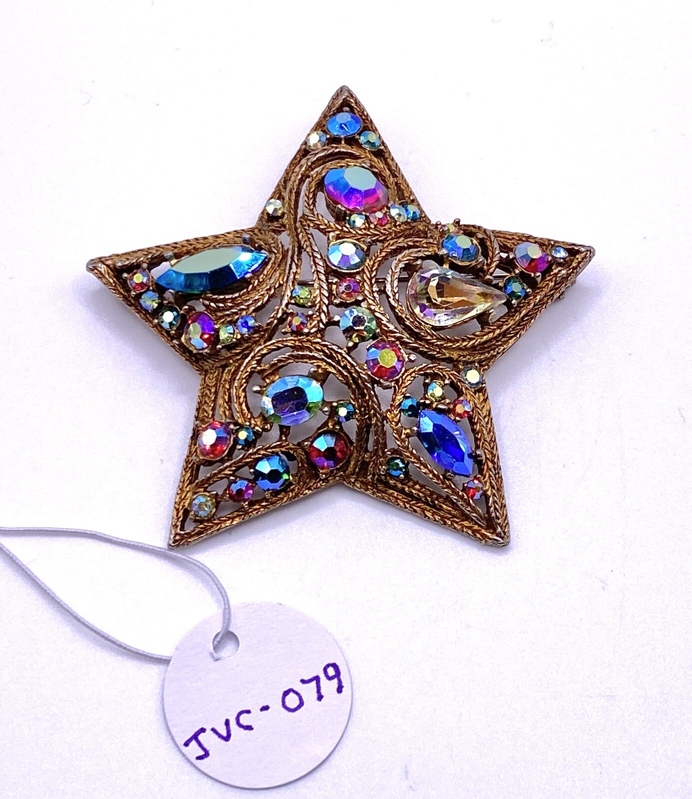 La Roco 1950s Star Brooch Colorful Gold Tone Rhinestones Textured Gold Plate