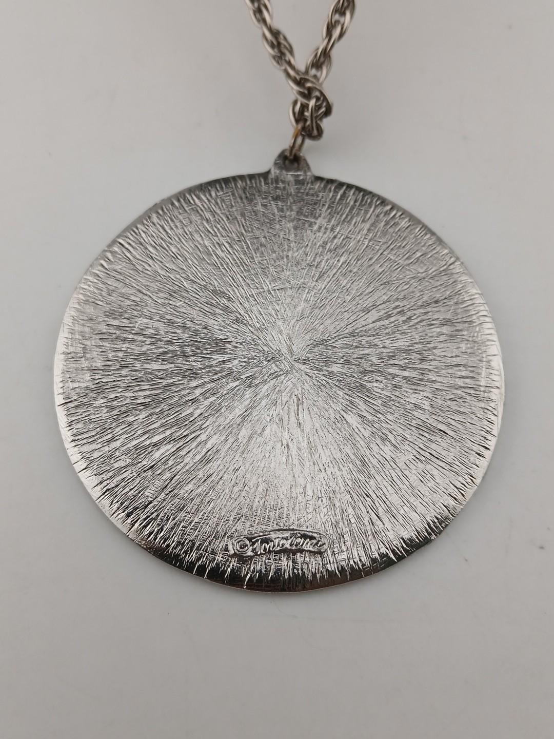 TORTOLINI 1960s silver tone Aztec Calendar textured design medallion necklace