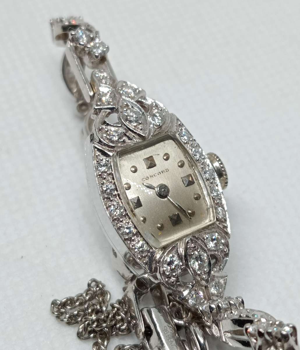 STAMPED IRID PLATINUM MANUAL CONCORD LADIES DIAMOND WRIST WATCH