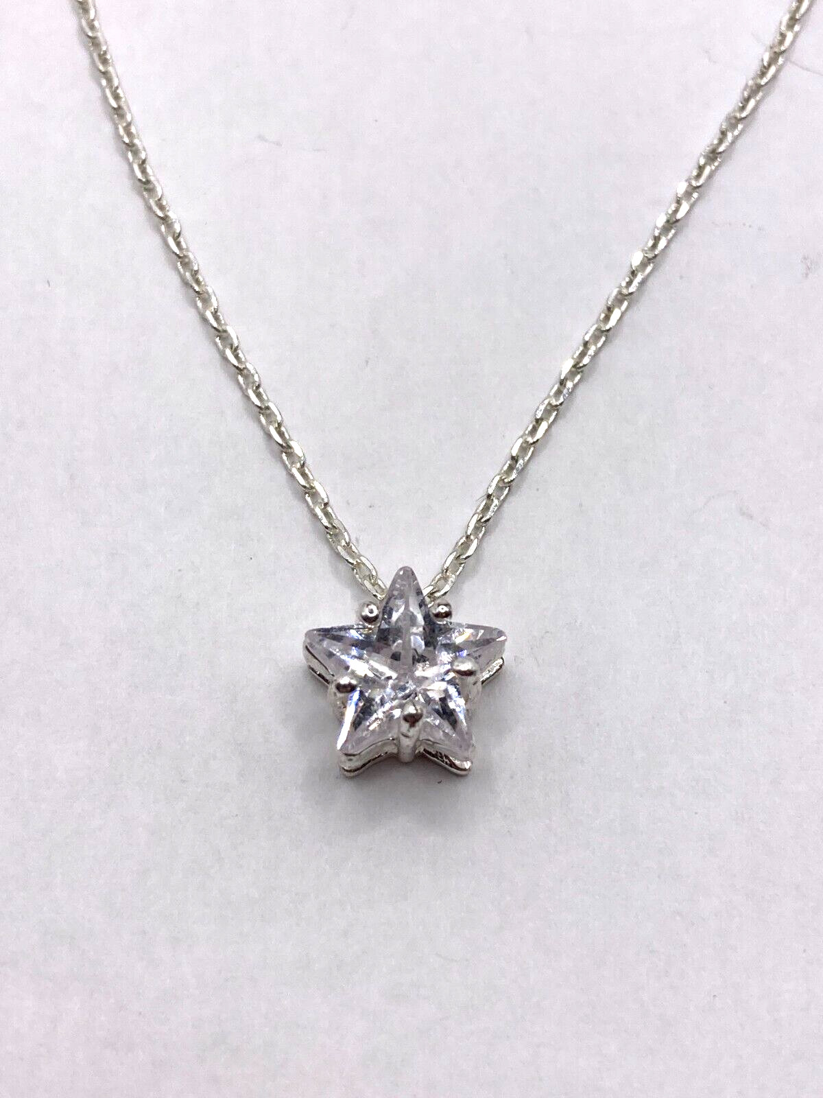 Shimmering Star-Shaped Clear Stone on Delicate Silvertone Necklace