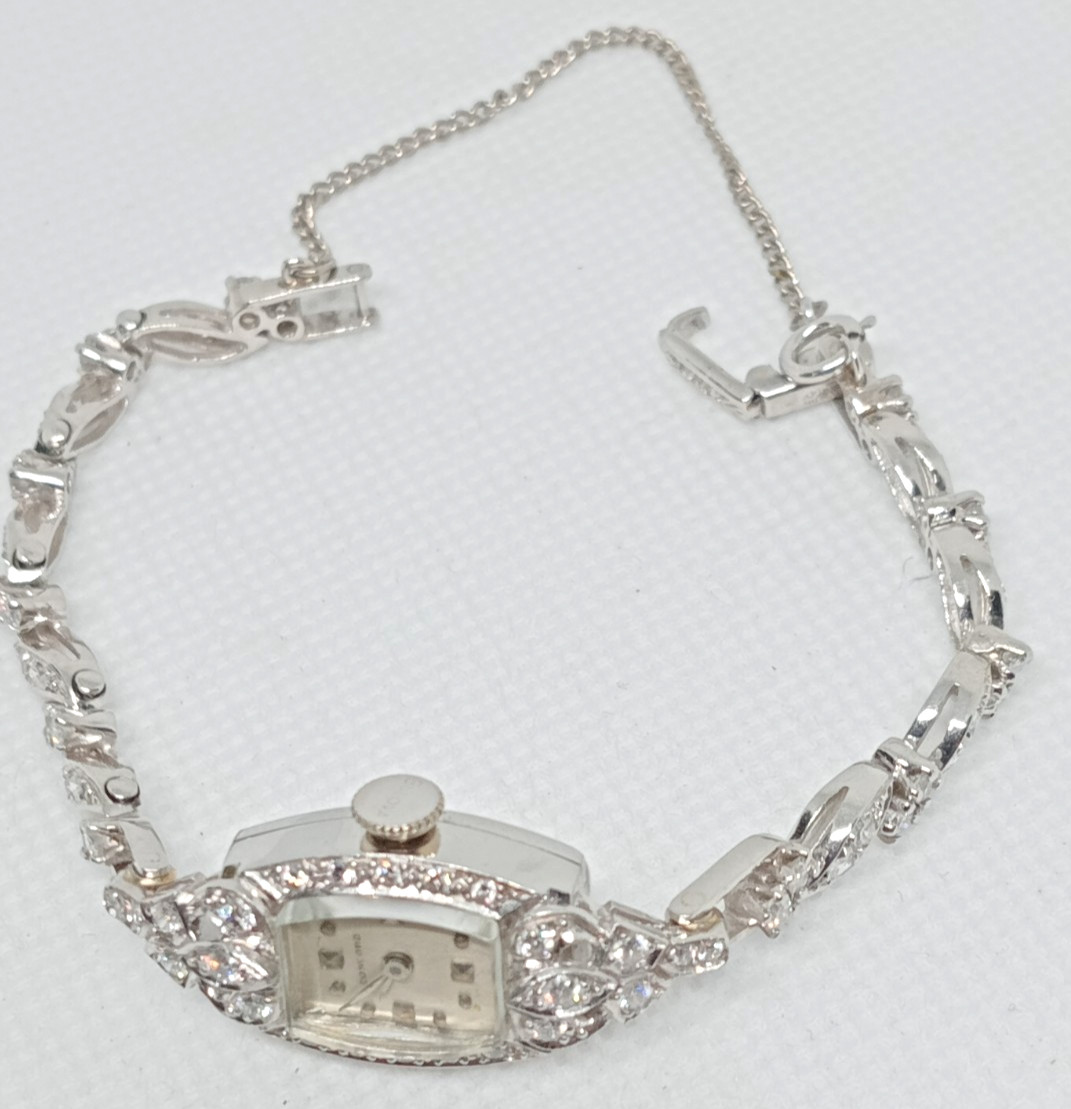 STAMPED IRID PLATINUM MANUAL CONCORD LADIES DIAMOND WRIST WATCH