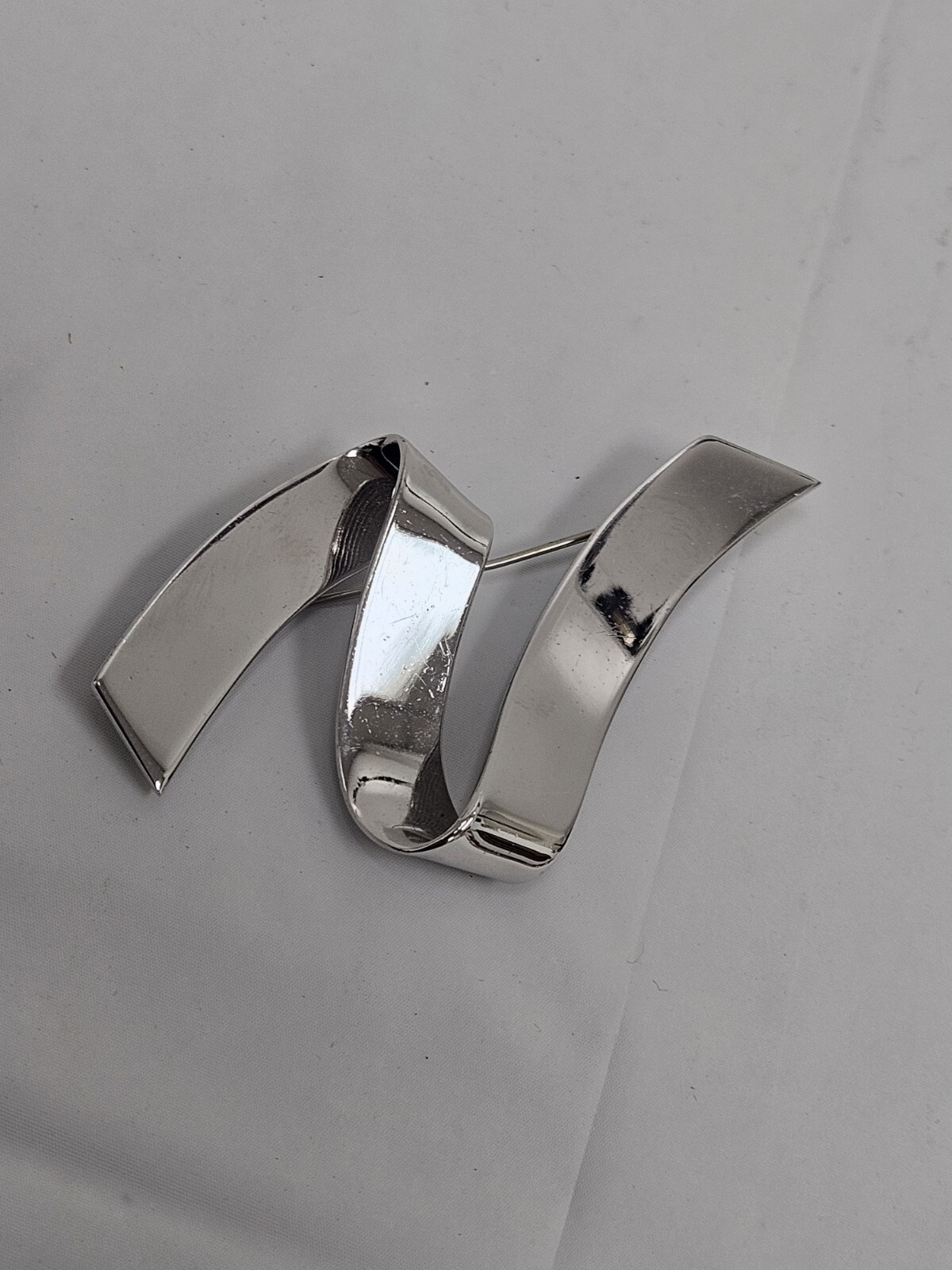 Vintage Monet Silver Tone Swirl Ribbon Pin Signed Mid Century Modern