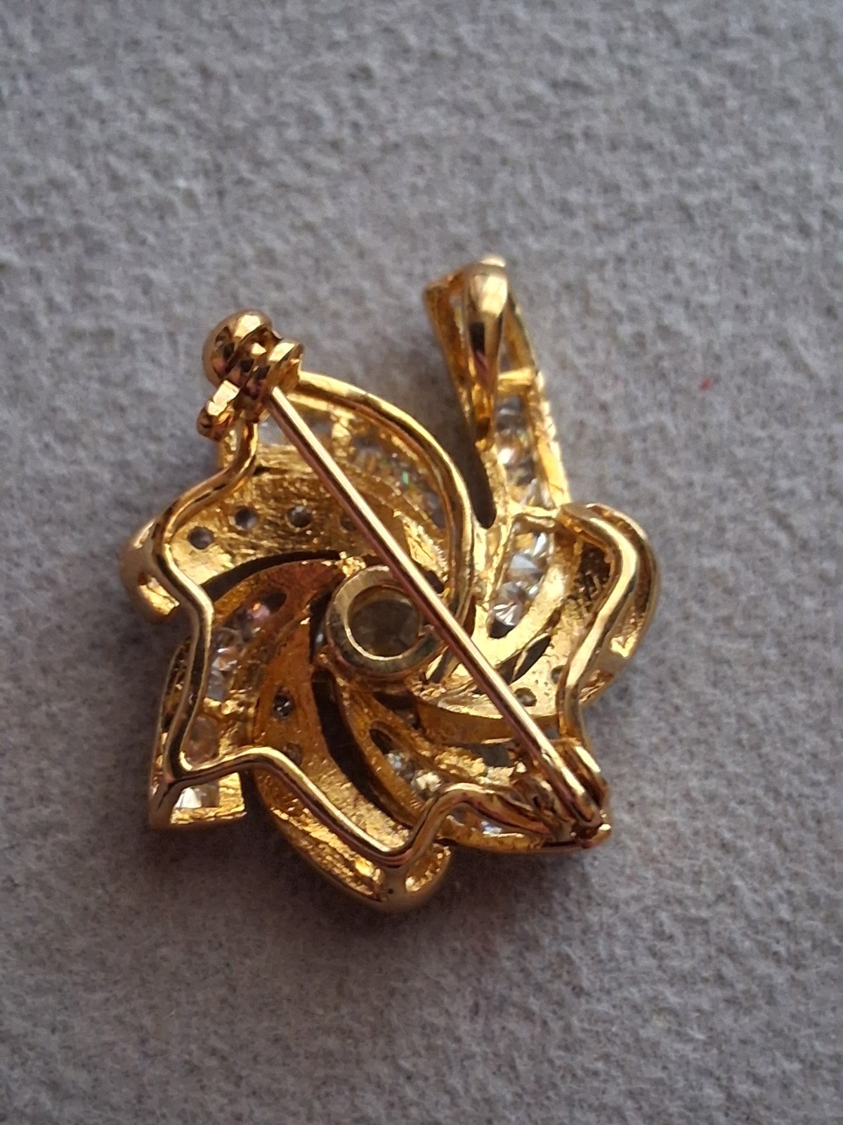 Pinwheel cubic zirconia embellished gold plated convertible brooch/pendant