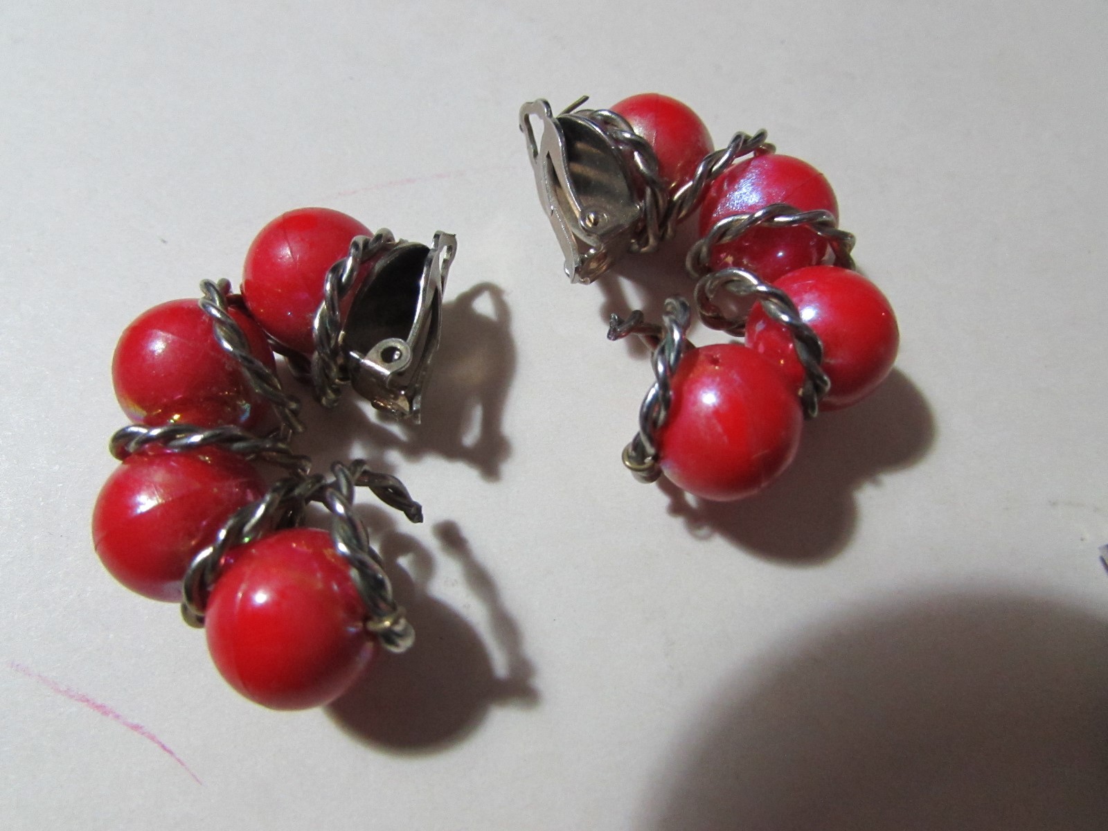 VINTAGE goldtone clip earrings almost 1 1/2″ long red bead half hoop