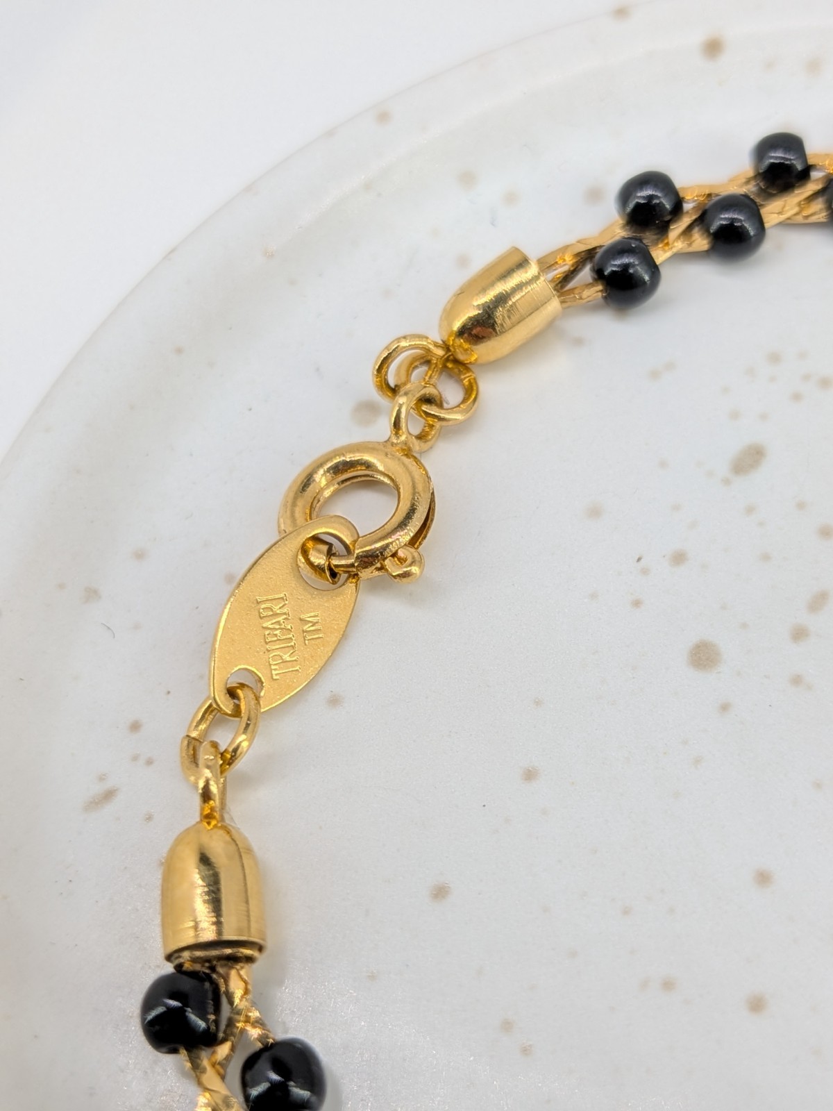 Vintage Trifari TM Bracelet Gold Tone Black Seed Bead Braided Link 7.5in Signed