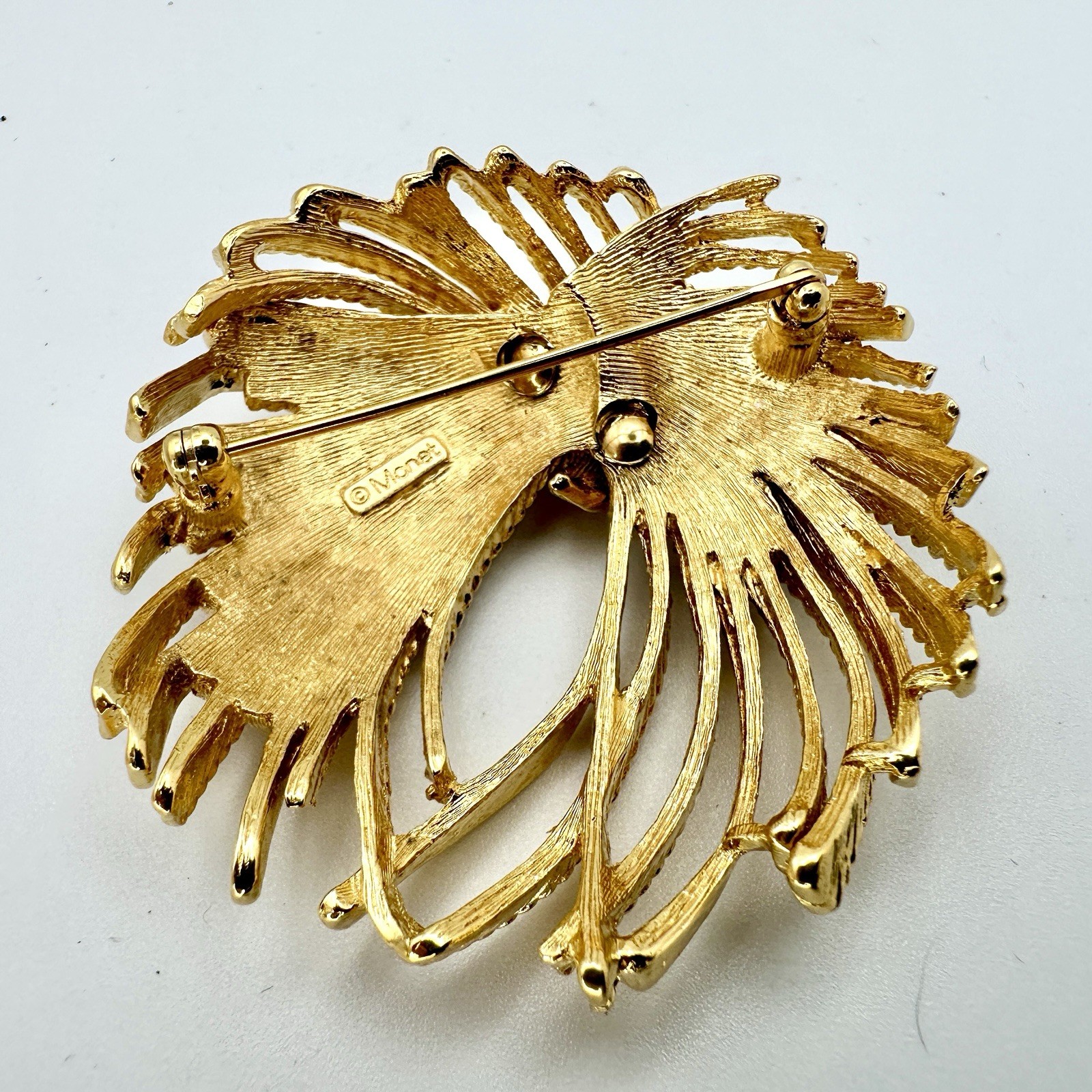 VTG MONET Cordelia Mirador Brooch Gold Tone Fire Works Knotted Rope Pin 2”