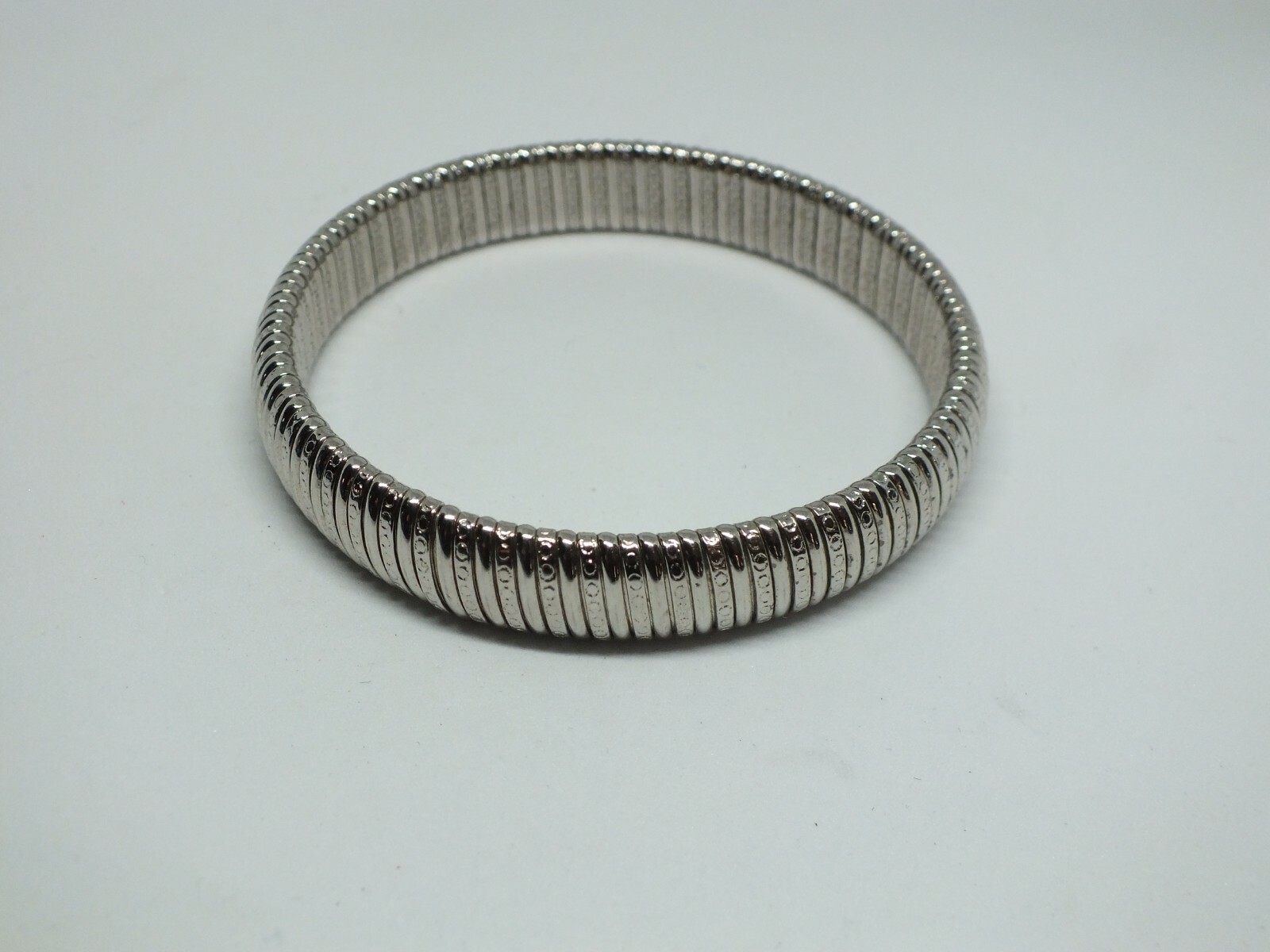 Beautiful Bangle Bracelet Silver Tone Texture Signed AVON 1/2″ W x 2 1/4″ Across