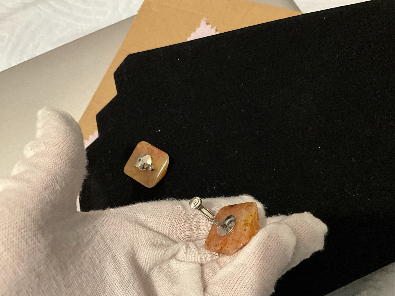 Bakelite Carved Apple Juice Clip On Earings About I 1/4 Inch Across 3/8 Thick.