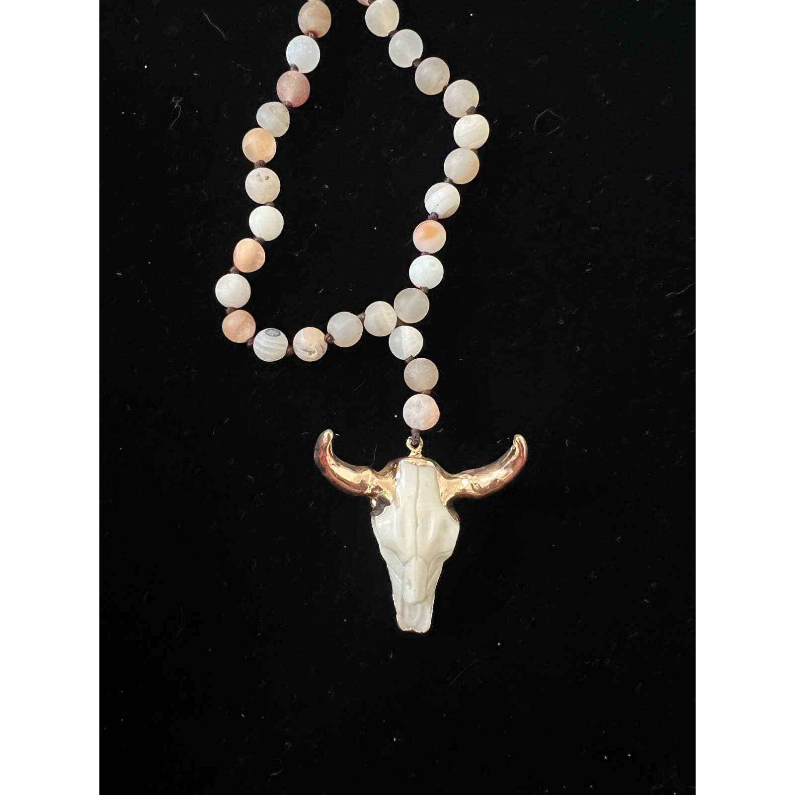 Hand knotted Bull necklace. Beads are either glass or real stones I’m not sure.