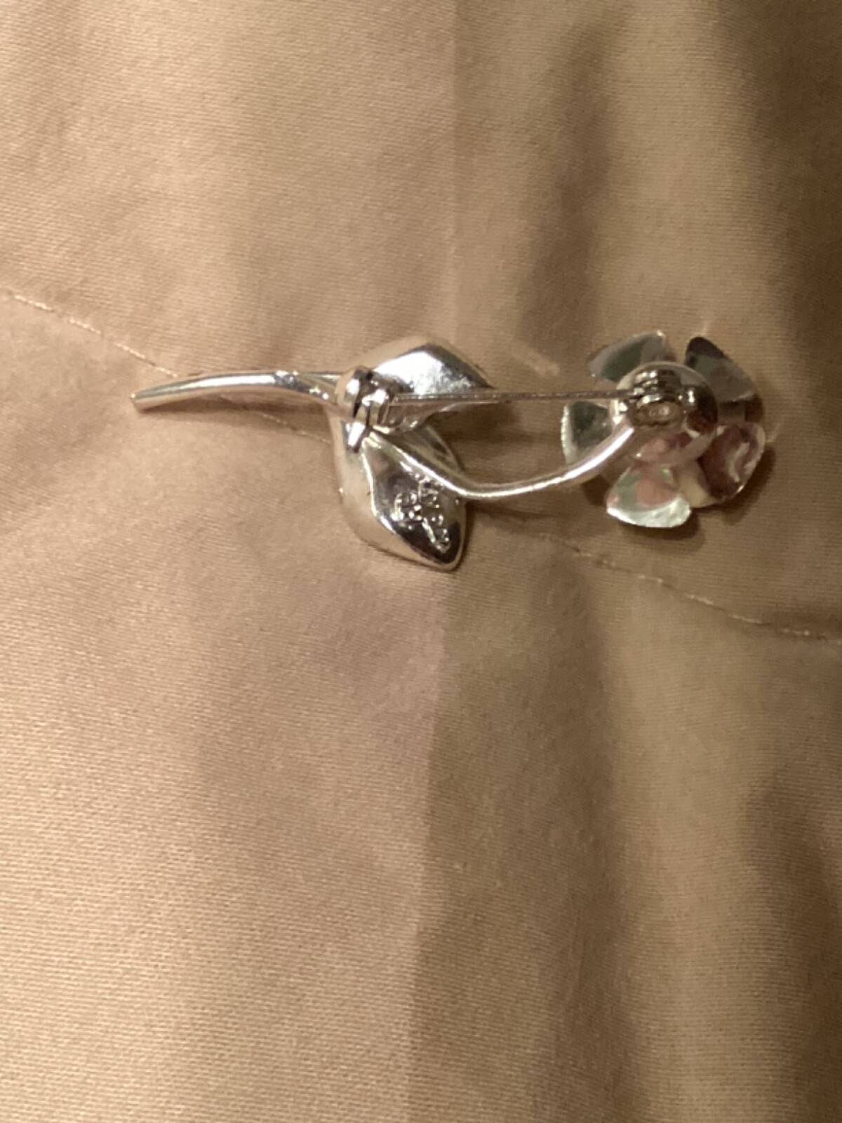 Avon vintage pin clear looking center with green leaves small almost 2” detailed