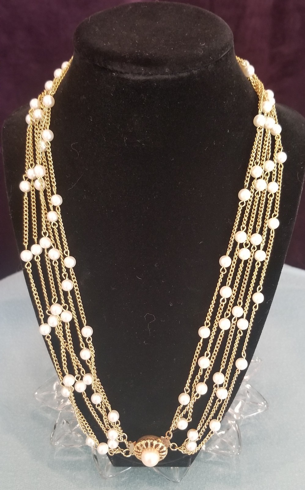Vintage Faux Pearl And Gold Tone 4 Strand Necklace With Decorative Clasp.