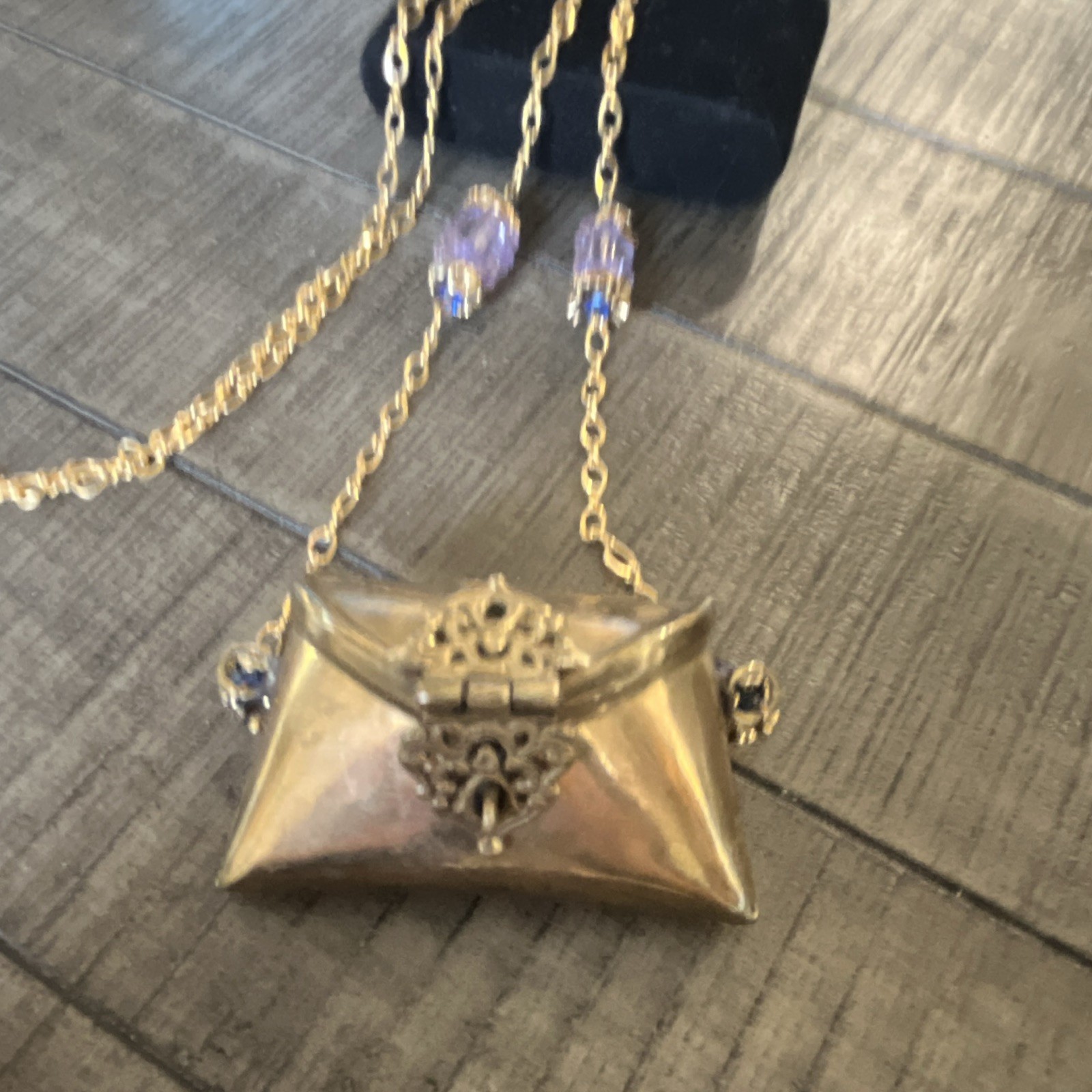 Antique Iris Lane pillow purse, necklace brass on gold filled chain.