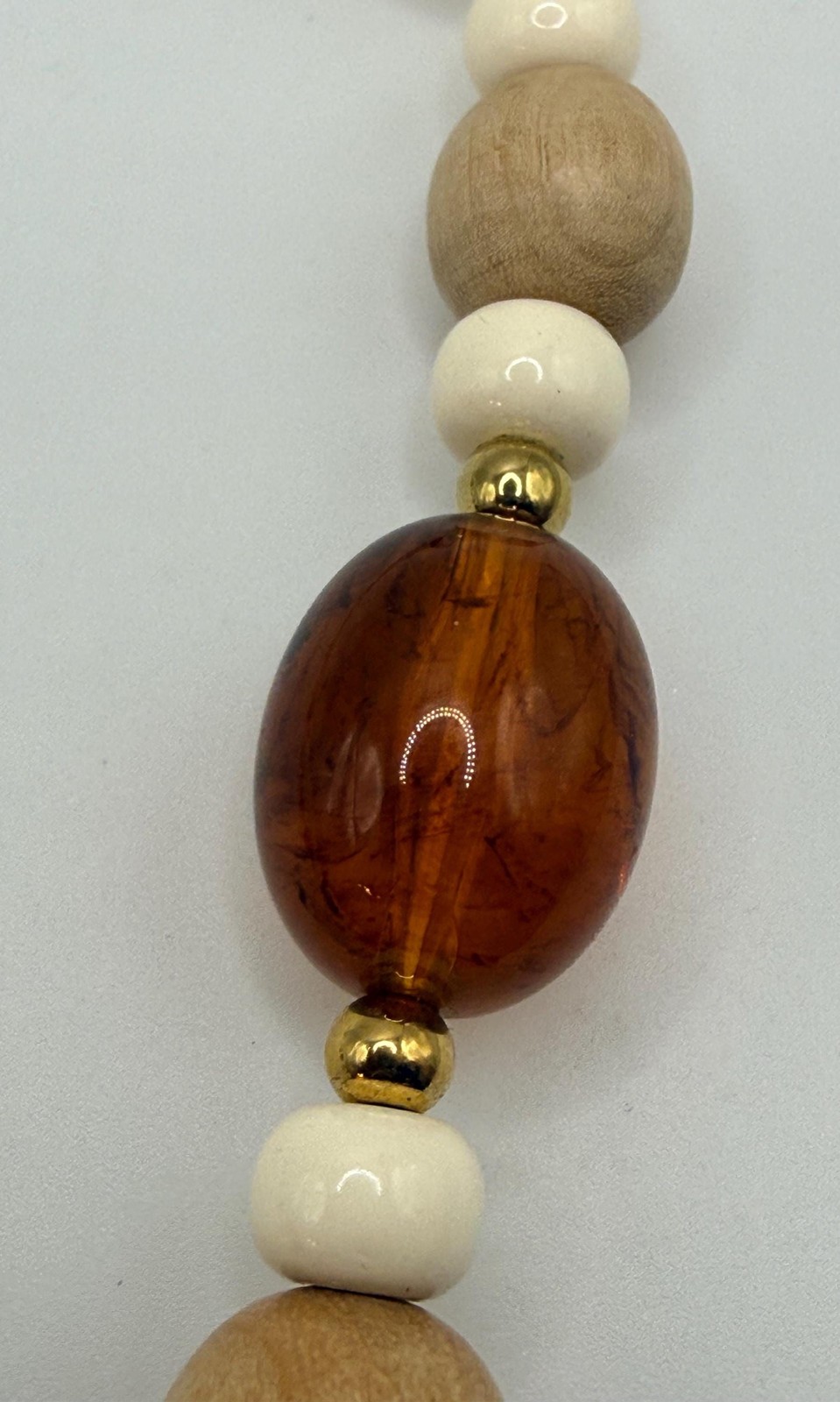 Vintage off white light wood and brown marbled amber colored beaded necklace