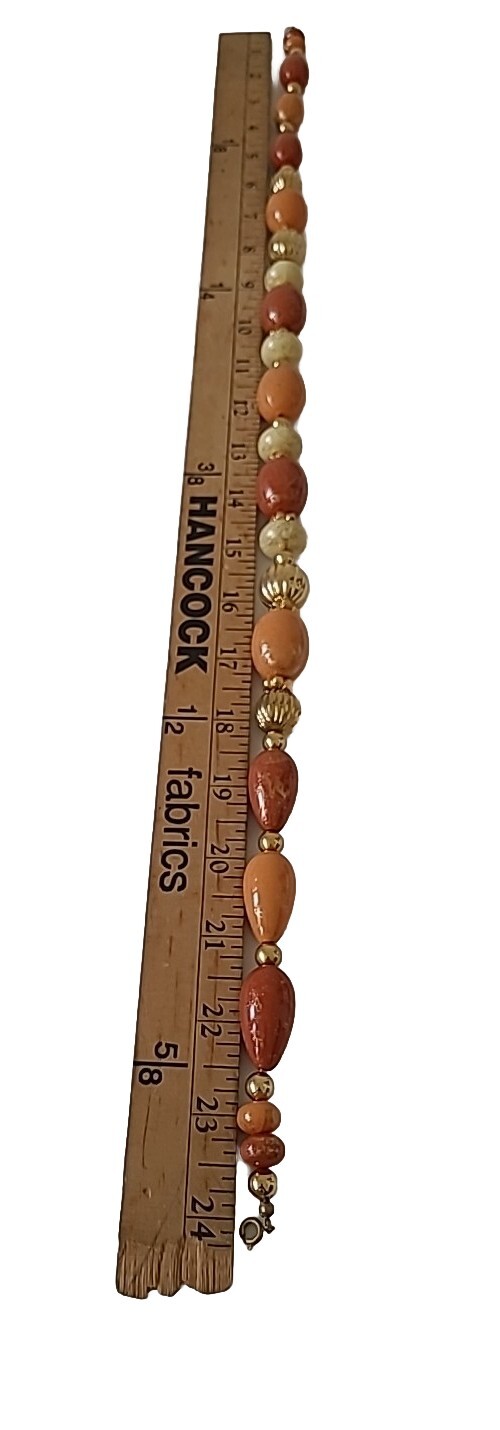 Vtg 24″ Speckled Gold Orange Cream Graduated Beaded Necklace w/Gold Tone Spacers