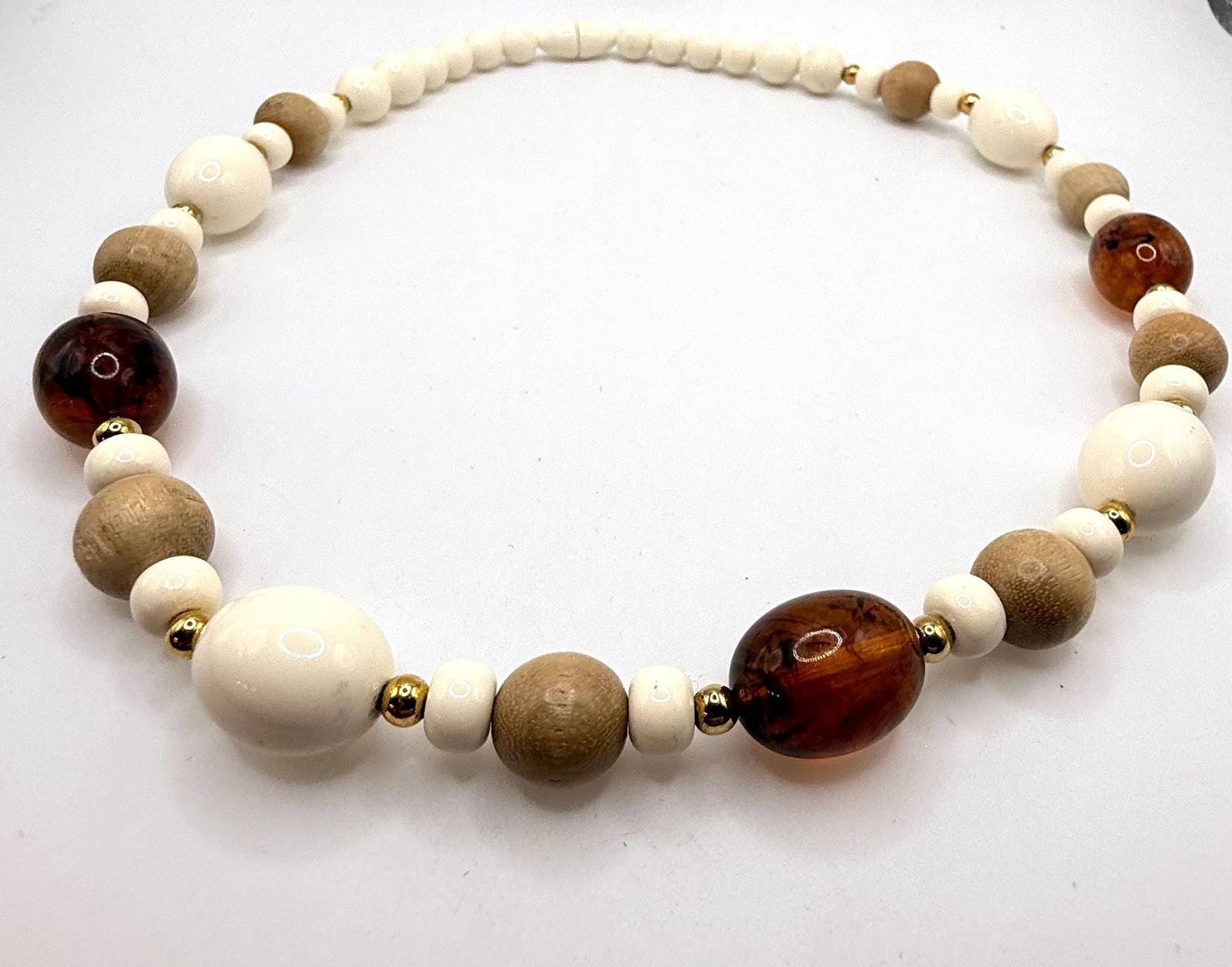 Vintage off white light wood and brown marbled amber colored beaded necklace