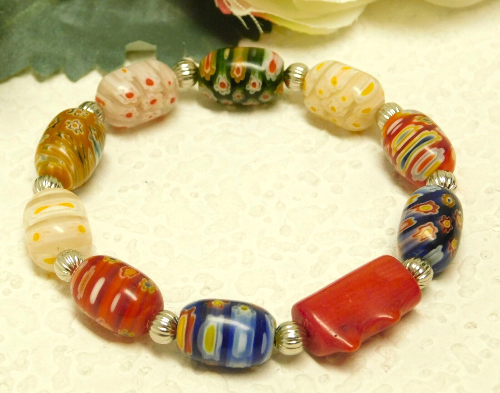RED CORAL, GLASS MILLEFIORI BARREL BEAD SILVER TONE ACCENTED STRETCH BRACELET