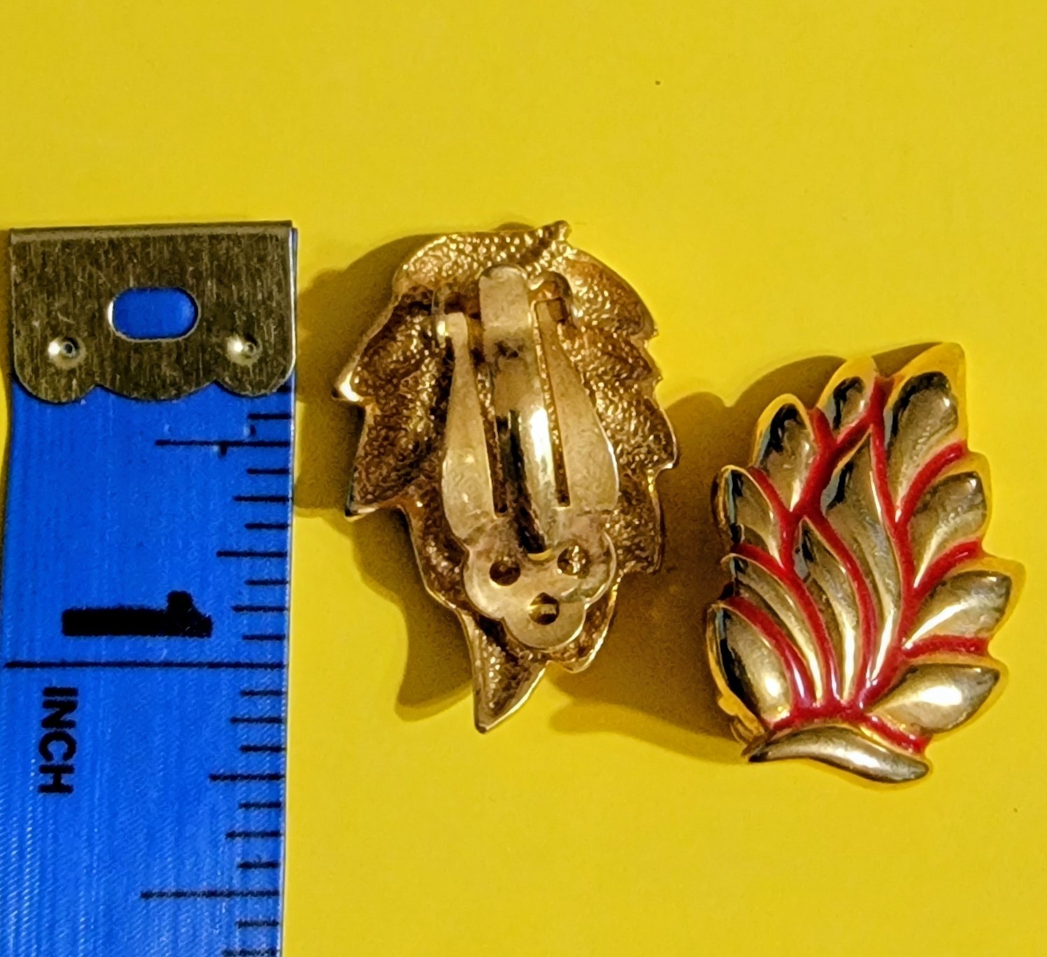 Vintage clip-on leaf design earrings with red enamel accents and polished go