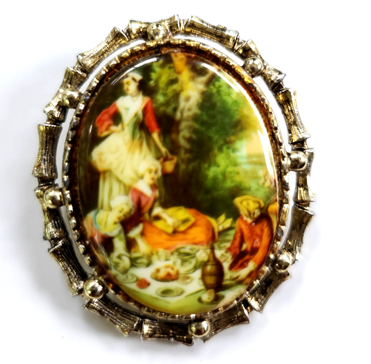 Vintage Brooch with Picnic Scene Painting and Bamboo-Style Metal Frame