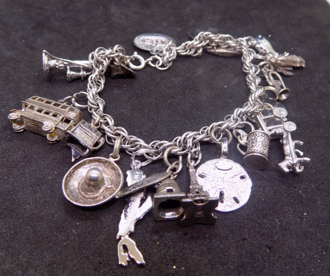vintage silver charm bracelet loaded with charms alot are marked sterling (541)
