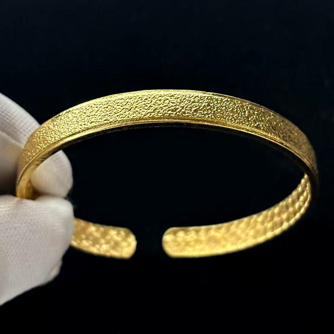 Golden Cuff Bangle Bracelet Gold-wash (NOT SURE) marked ‘999’, 7.5 in adjustable