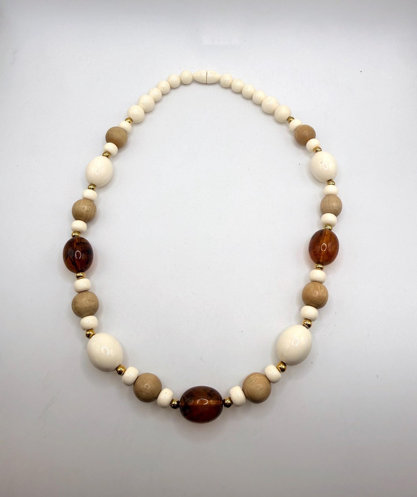 Vintage off white light wood and brown marbled amber colored beaded necklace