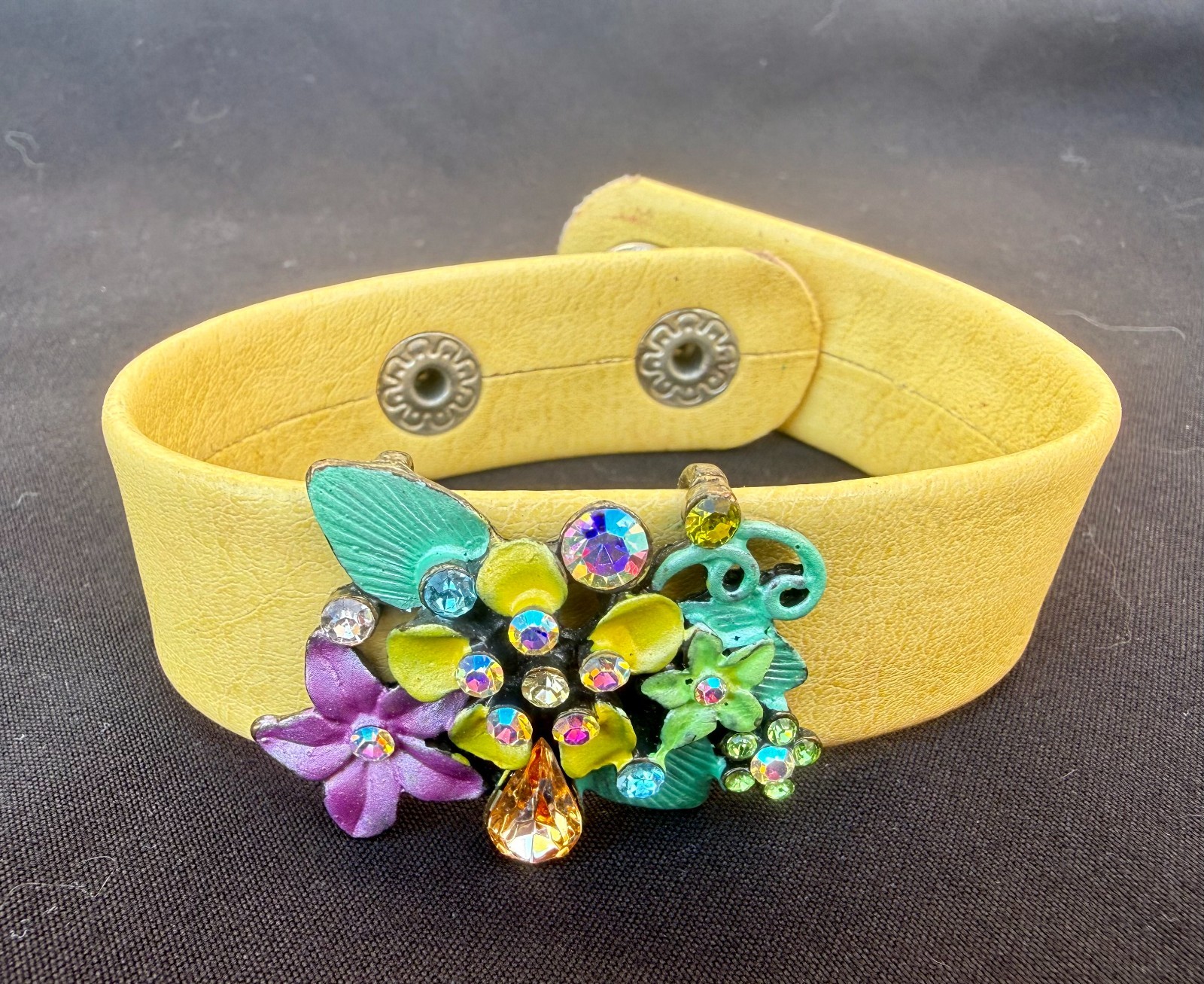 Vintage Yellow Leather Snap Cuff Band with enamel and rhinestone floral cluster