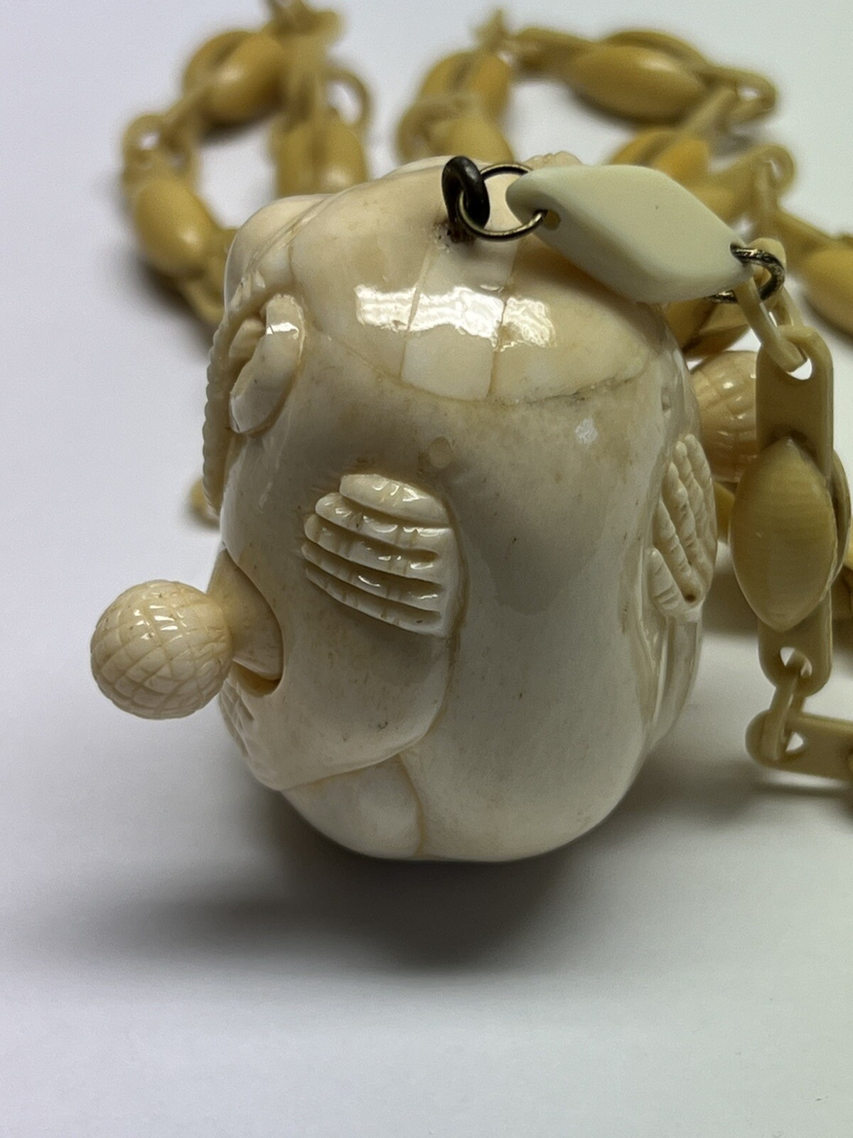 ANTIQUE ART DECO MONKEY NECKLACE TAPE MEASURE CELLULOID CHAIN PENDANT WHIMSICAL