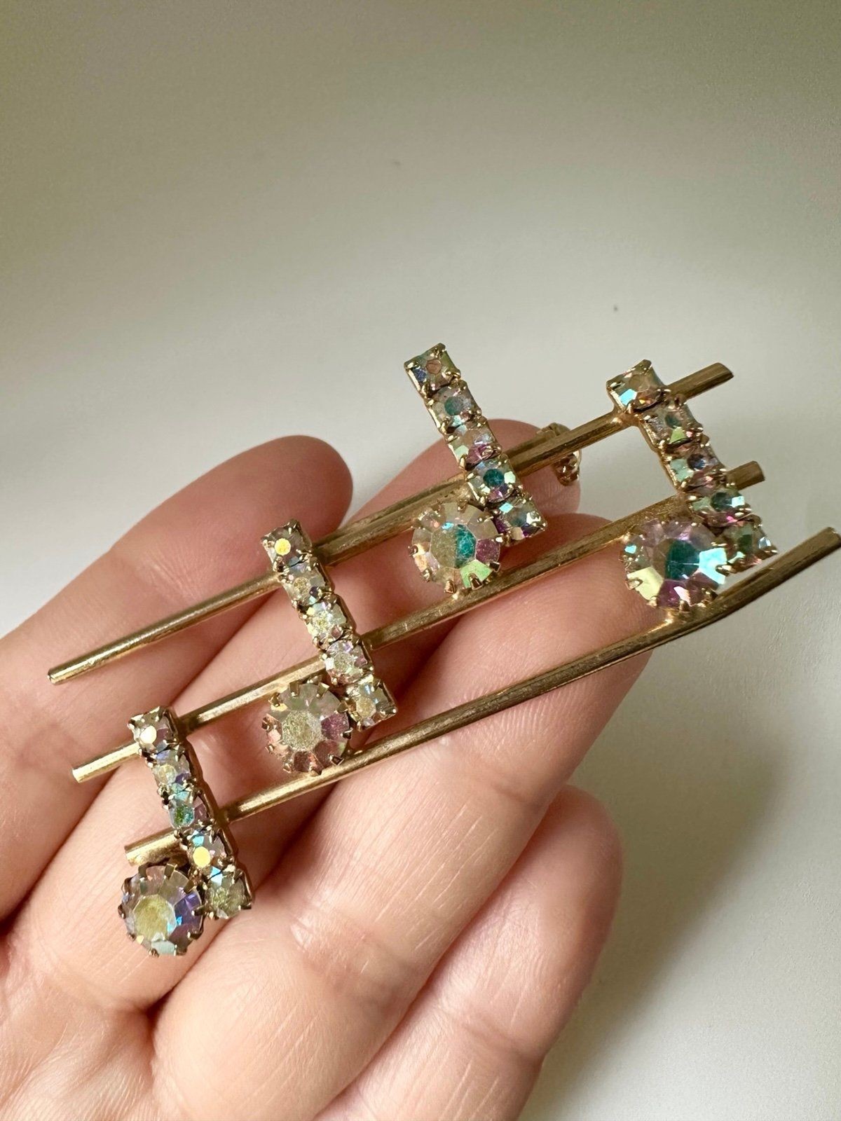 Vintage gold tone rhinestone music notes brooch
