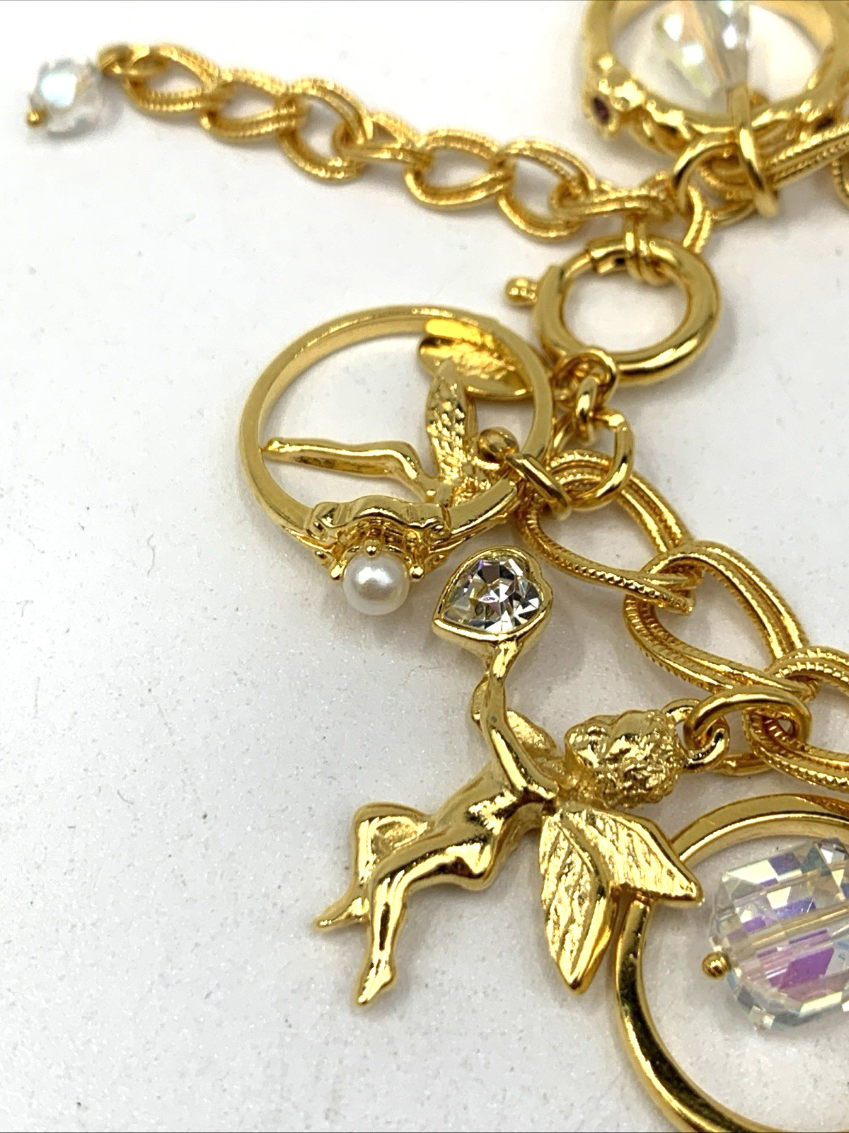 Kirks Folly Gold Tone Charm Bracelet Cupid Hearts Rings Crystals Angel