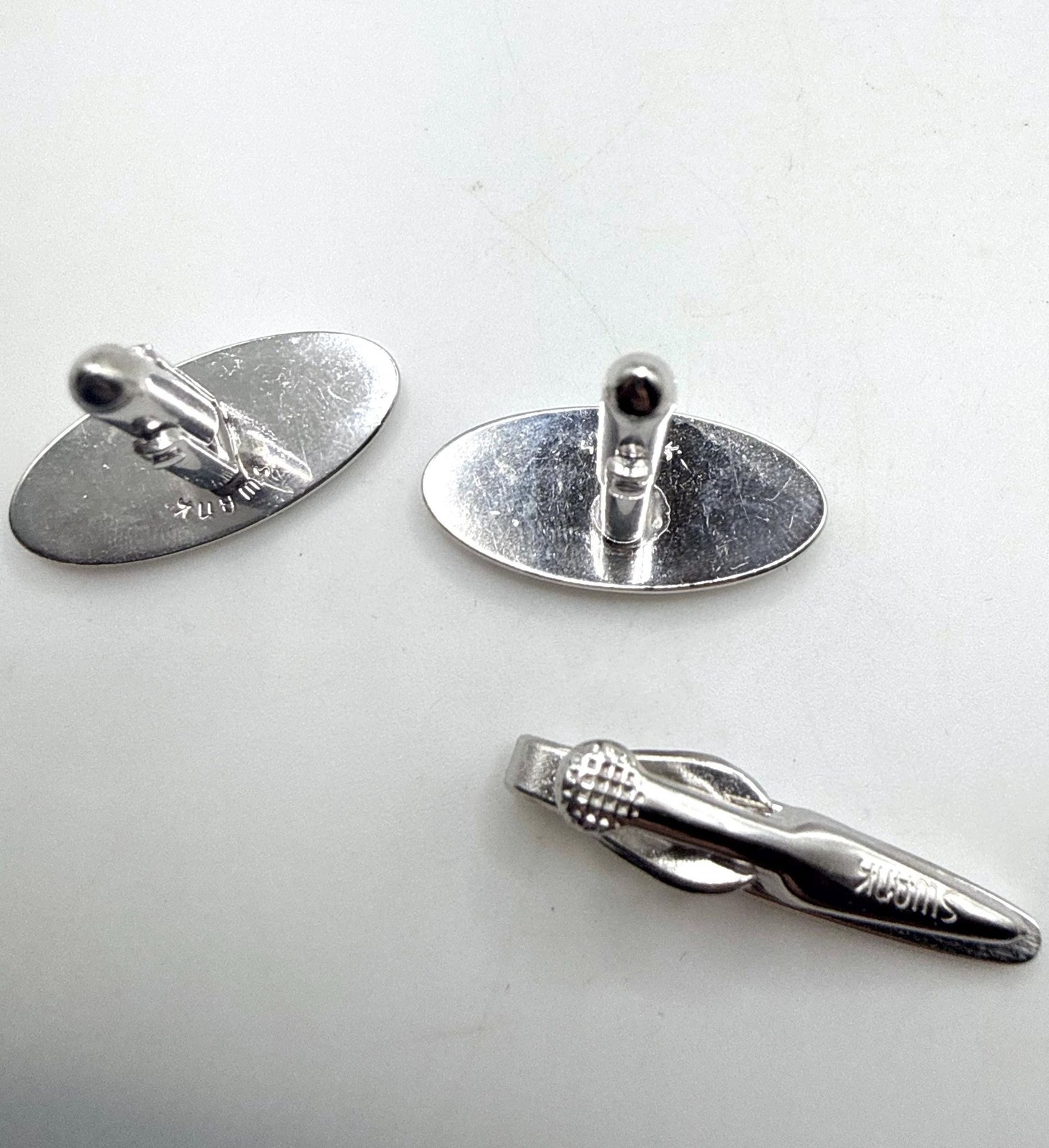 Vintage Swank silver tone textured elongated oval cuff links and tie clip set