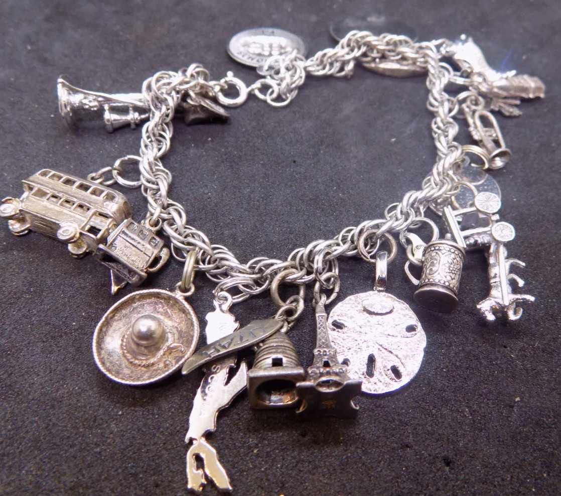 vintage silver charm bracelet loaded with charms alot are marked sterling (541)