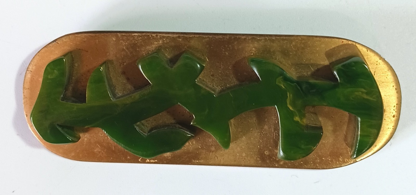 Vintage Art Deco Brooch: Carved Dark Green Bakelite on Polished Oval Brass Base