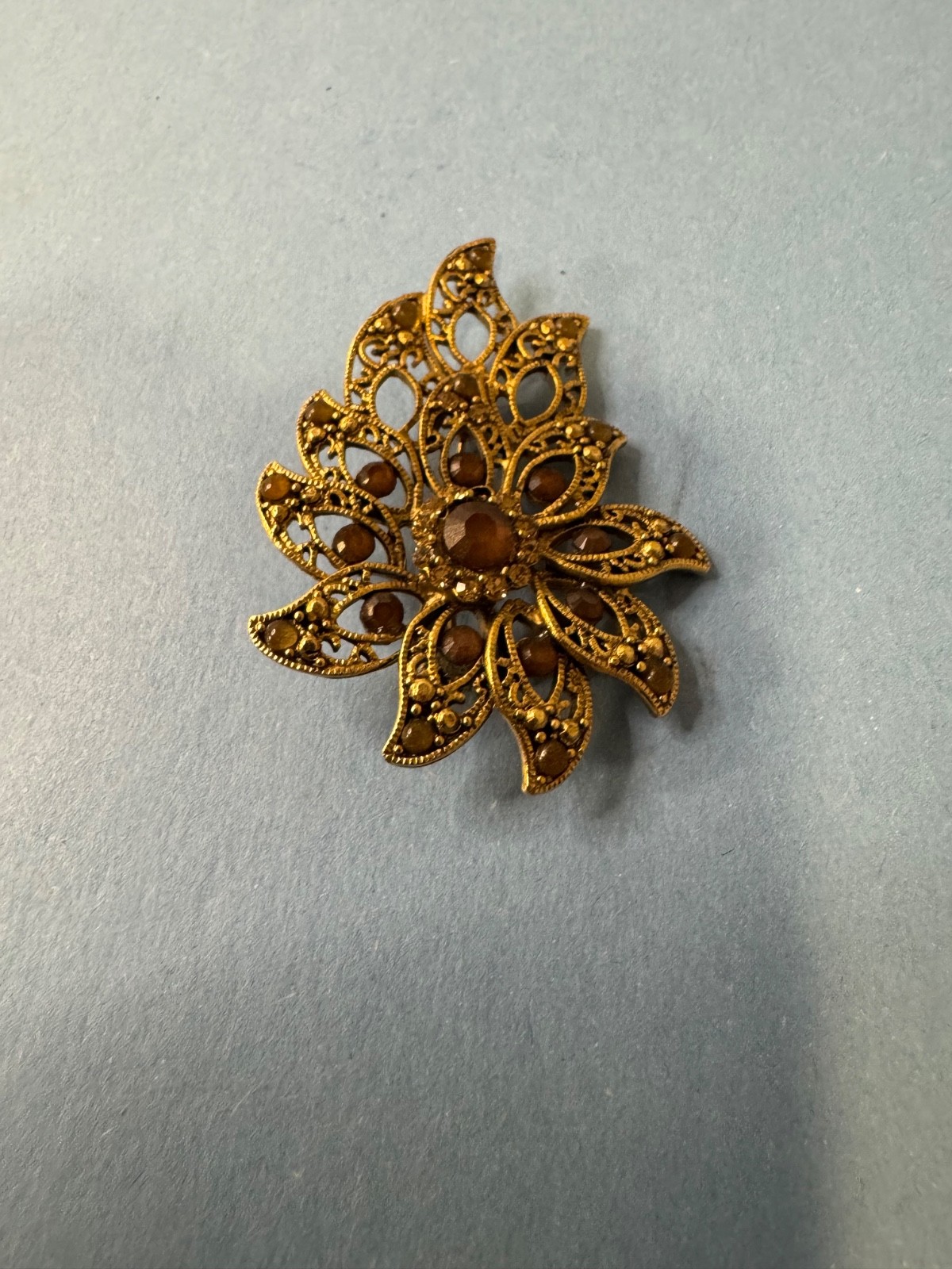 Gold Tone Brooch with Amber and Brown Glass Stones In A Floral or Leaf Design