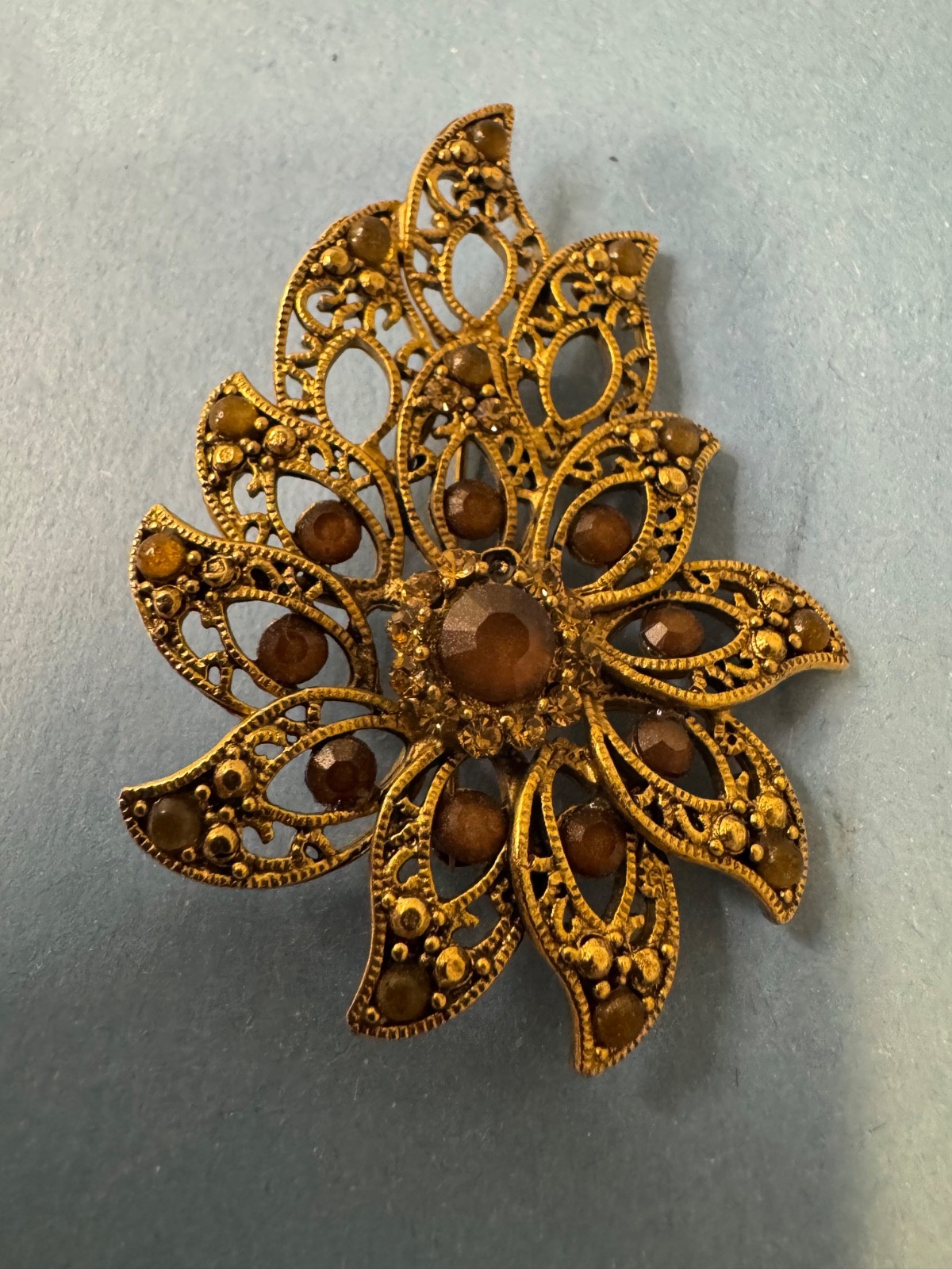 Gold Tone Brooch with Amber and Brown Glass Stones In A Floral or Leaf Design