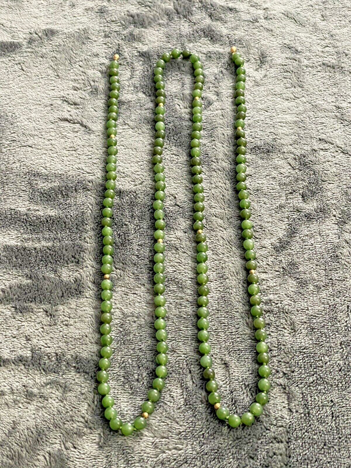 Marilynn Alsdorf Collection Spinach Jade 43″ Lavalier from Sotheby’s Auction