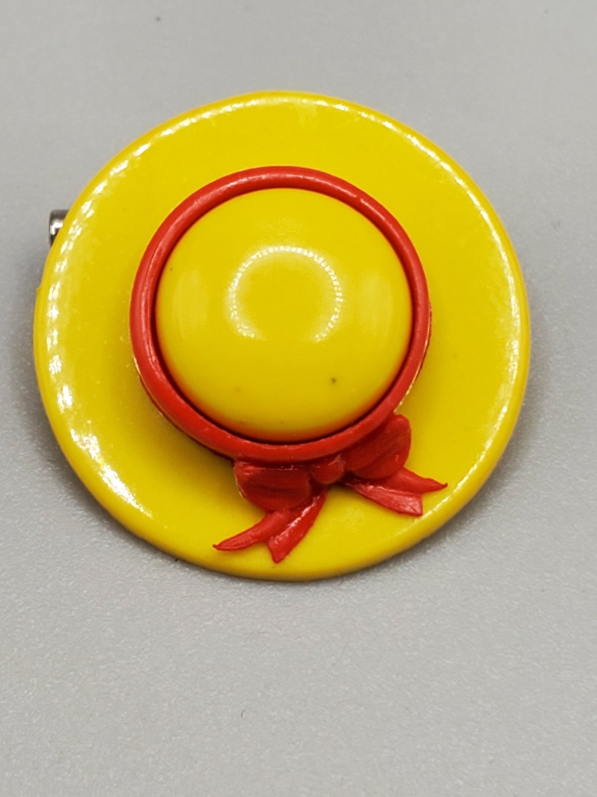 Vintage Small Yellow Hat With Red Bow Plastic Pin or Brooch