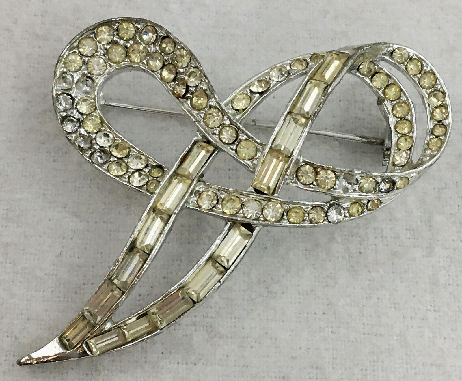 SilverTone Swirl Ribbon Brooch Pin With Clear Round with Bagette Crystals TG
