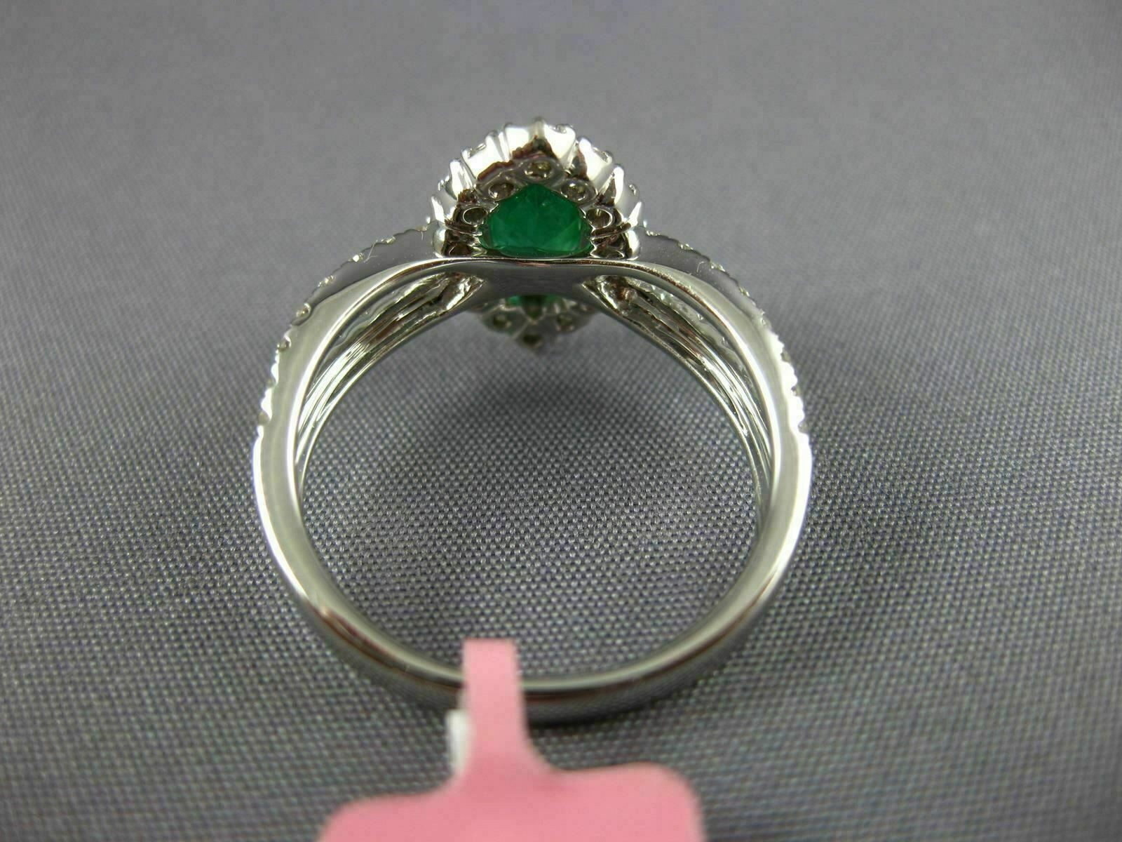 ESTATE 1.53CT DIAMOND & AAA EMERALD 18KT WHITE GOLD CLASSIC HALO ENGAGEMENT RING