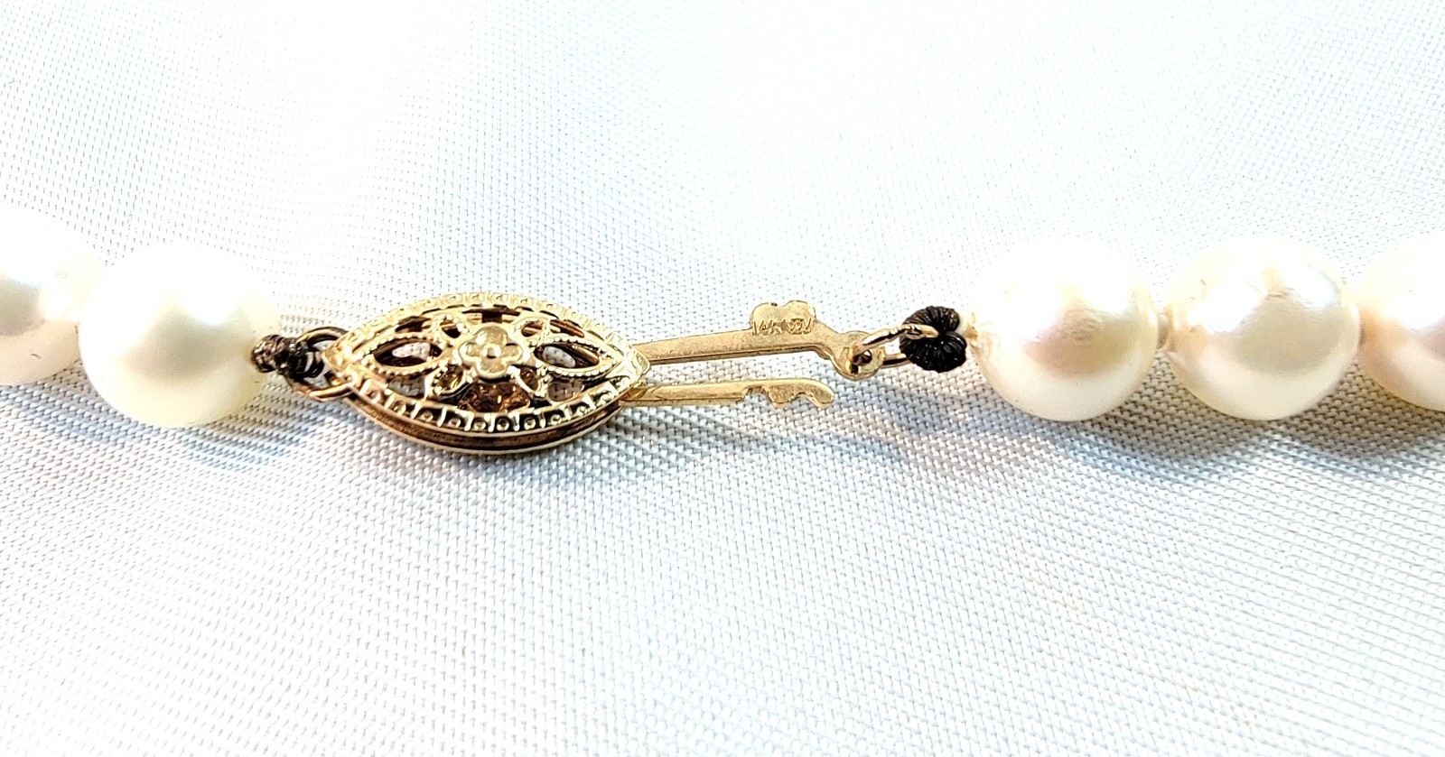 Vintage Pearl Necklace 6.9mm Pearls and 14K Gold Clasp 23.5 in Matinee Length
