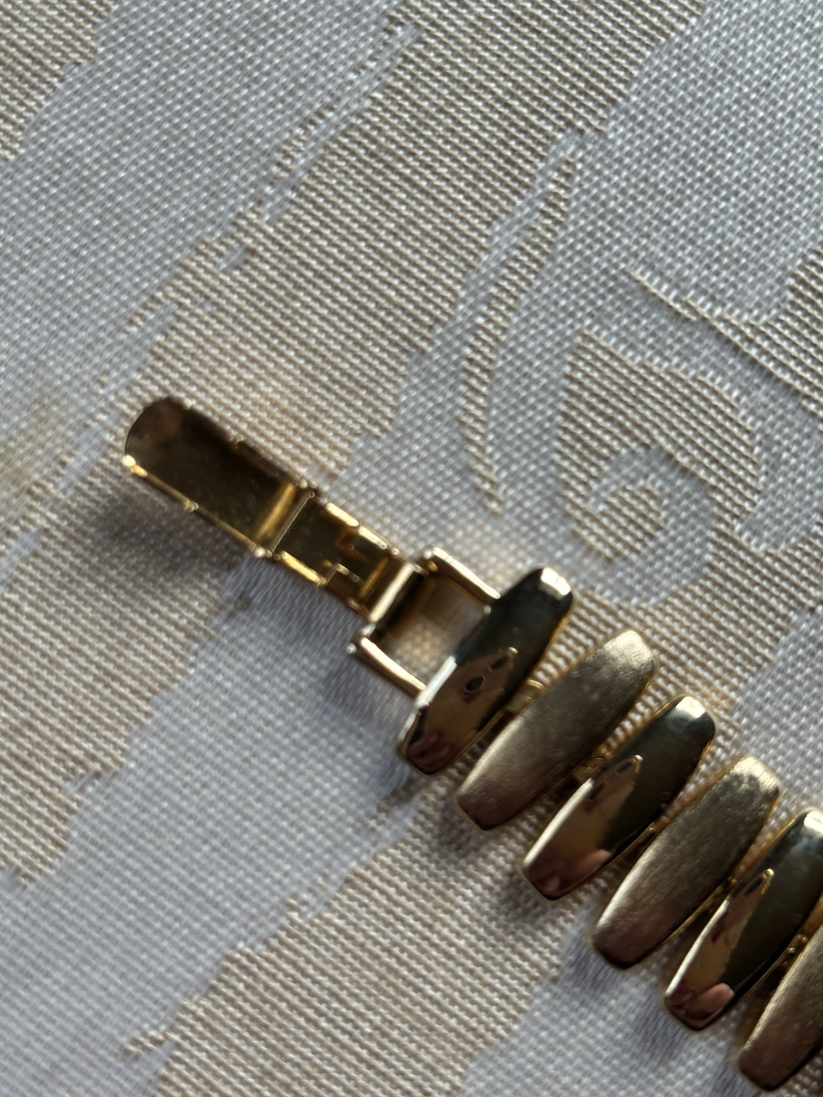 Vintage Napier gold-tone link bracelet featuring articulated, curved links 6.5”
