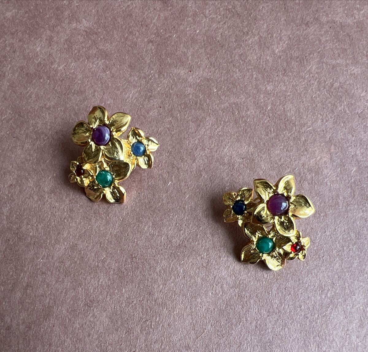 Avon Gold Tone Four Flower Earrings With Blue And Purple Gem Centers