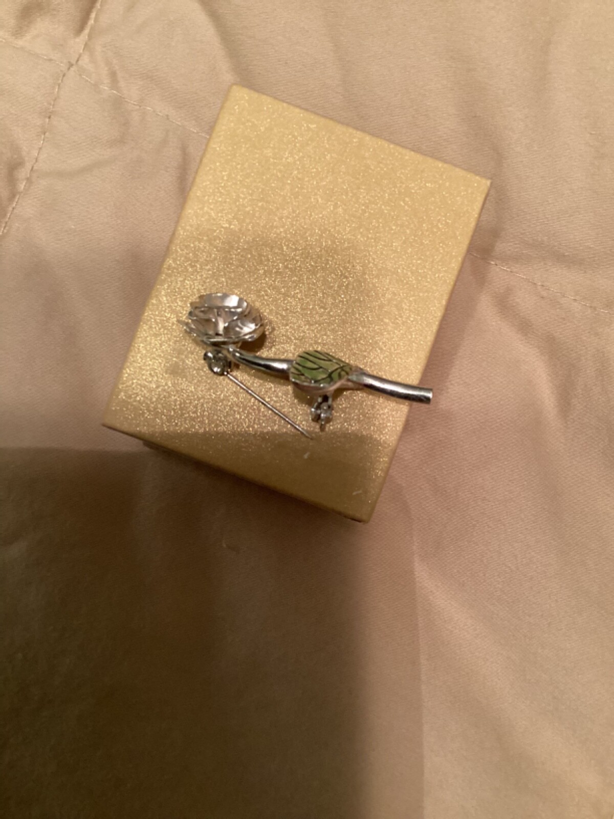 Avon vintage pin clear looking center with green leaves small almost 2” detailed