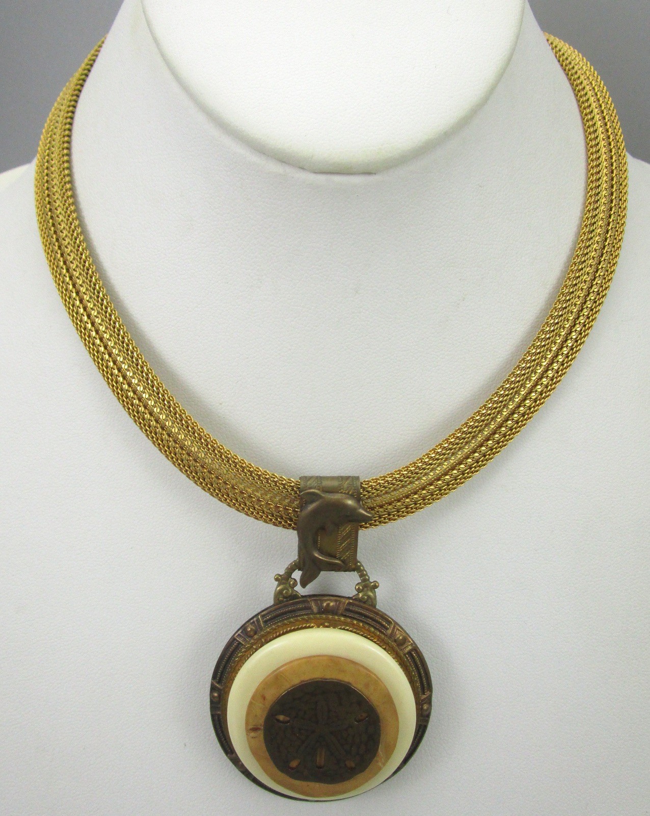 LOVELY PATRICE BRASS RESIN &  SHELL SAND DOLLAR DOLPHIN STATEMENT NECKLAC