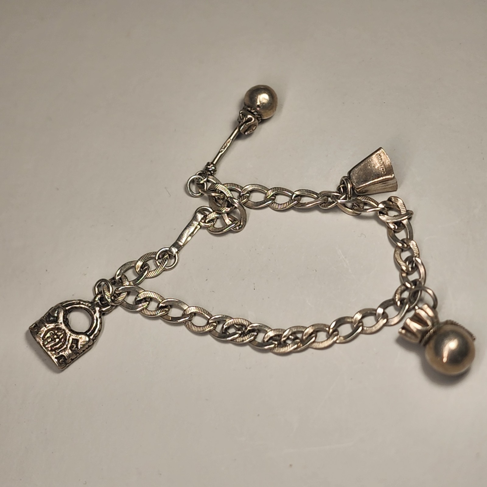 Sterling Silver Bracelet Charm Bracelet 14 Gms 7-1/2″ Long Four Silver Charms
