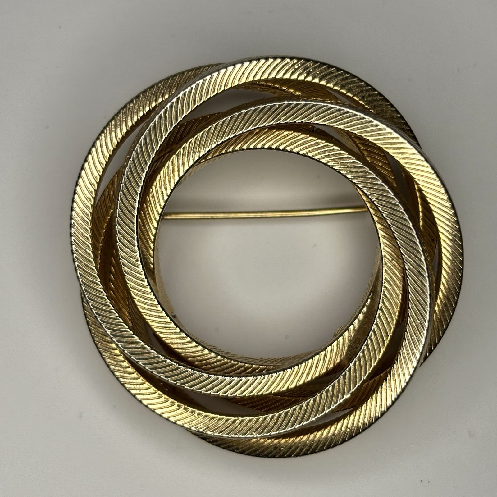 Vintage Gold Tone Textured Triple Swirl Circle Brooch Pin – Costume Jewelry