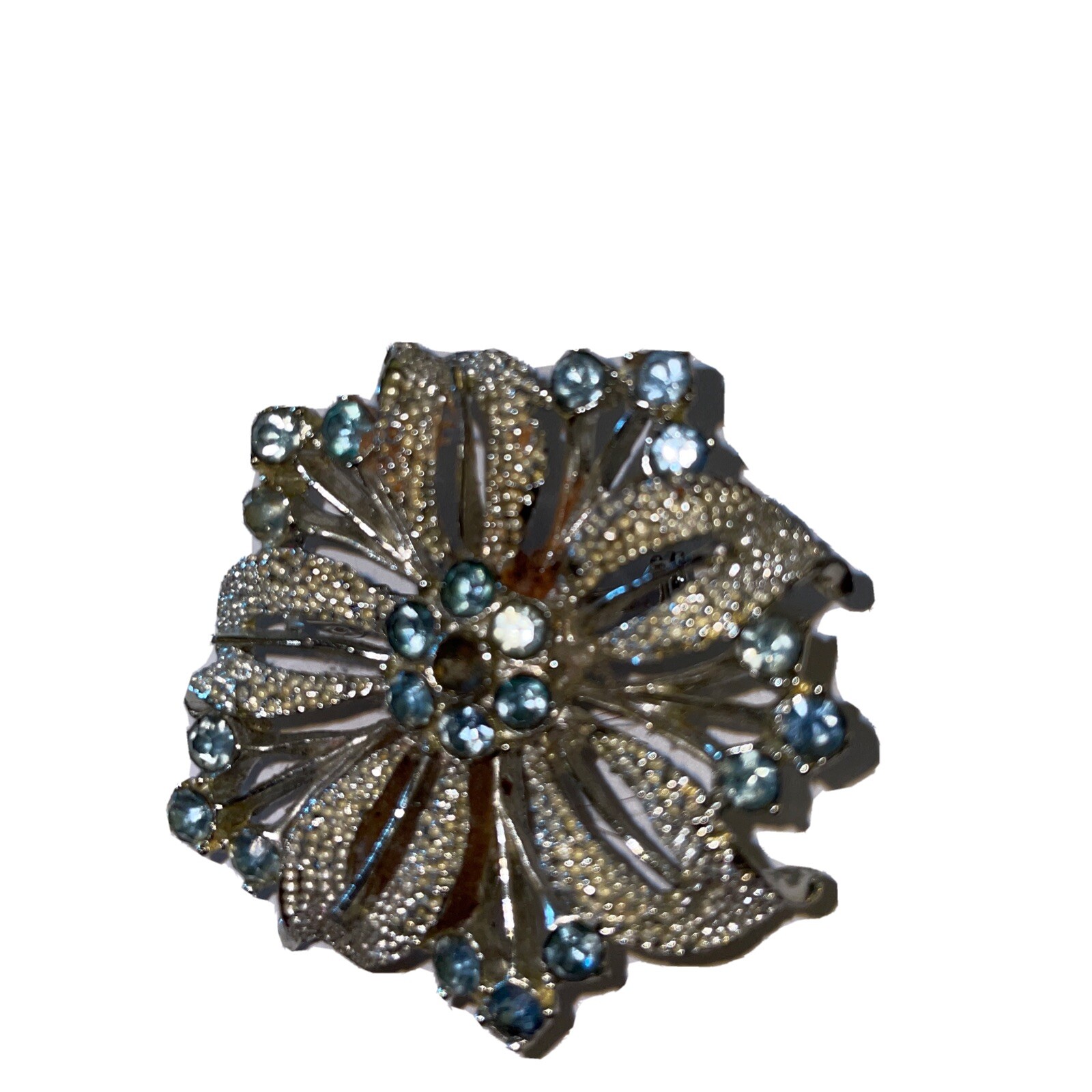 Silver-tone flower brooch w/ pale blue stones (center stone missing)–preowned