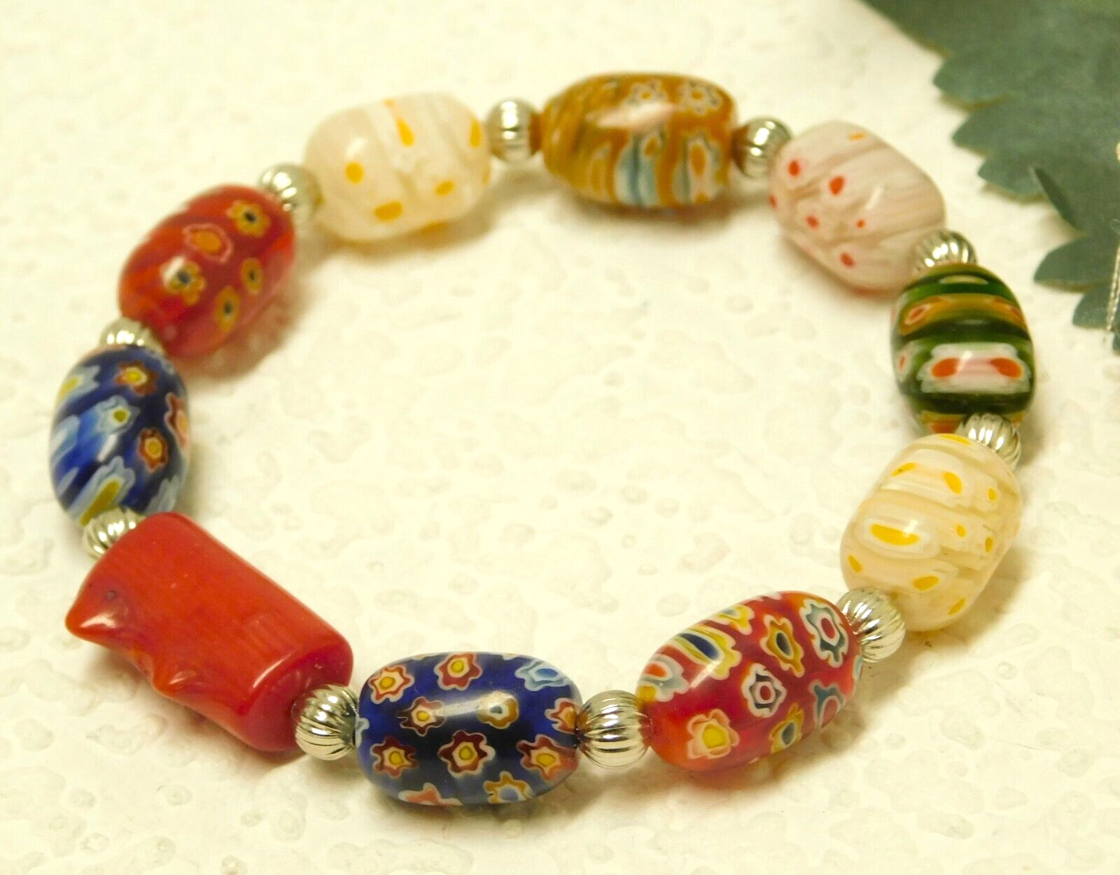RED CORAL, GLASS MILLEFIORI BARREL BEAD SILVER TONE ACCENTED STRETCH BRACELET