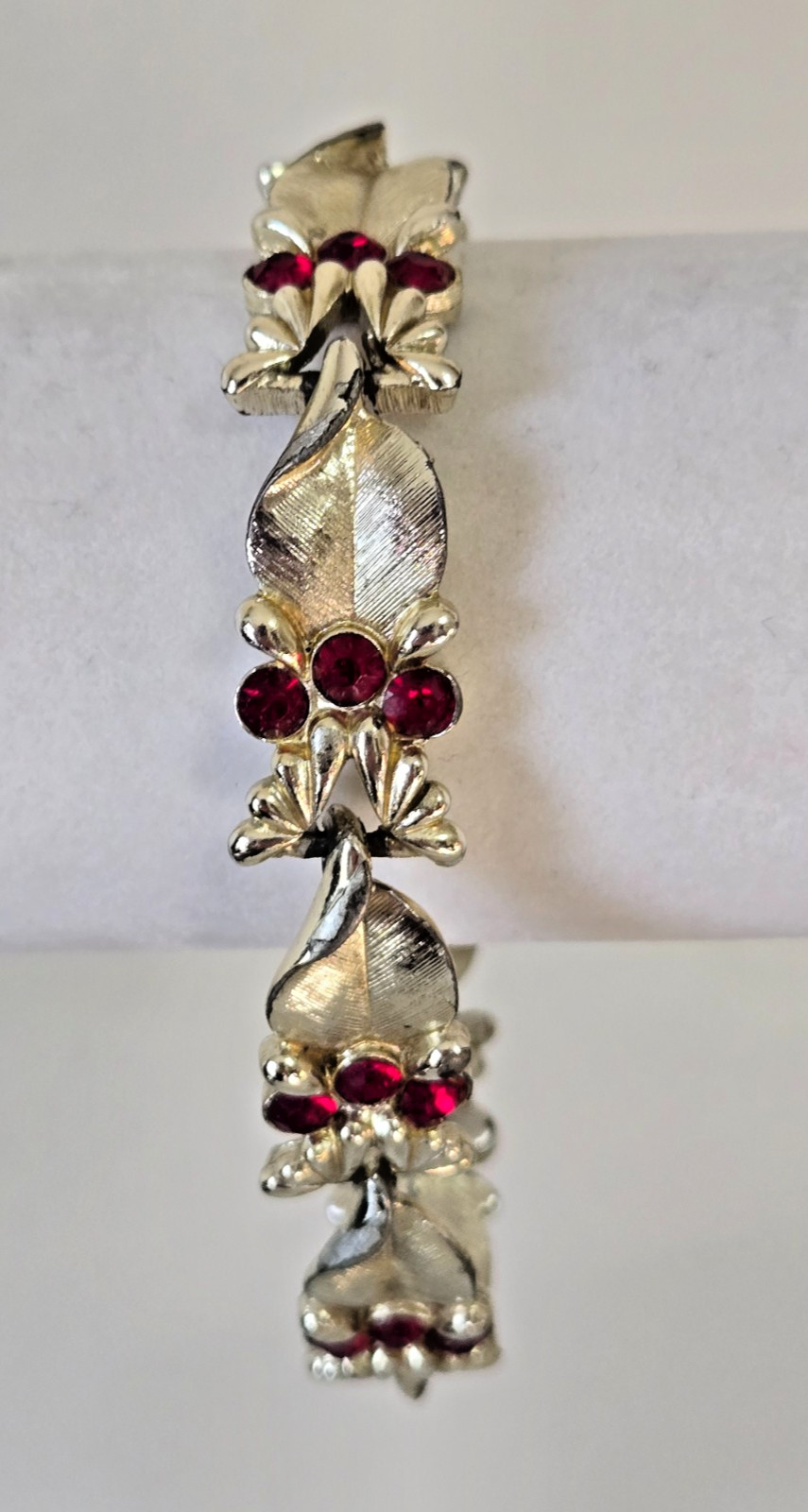 Vintage STAR Bracelet. Signed. Goldtone Setting with Red Rhinestone Accents.